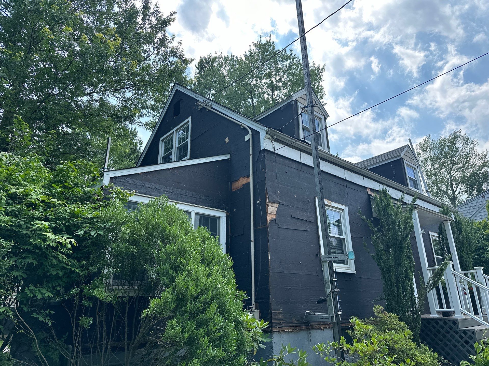 Complete Exterior Estate gray with Pacific Blue Siding by A Plus Exterior