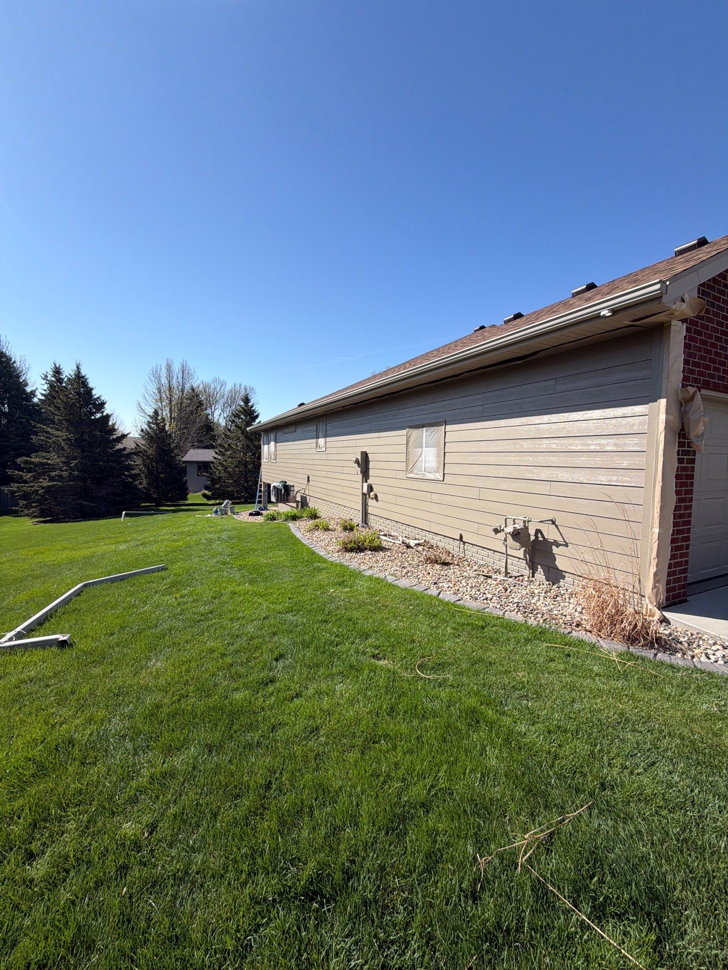 Residential Exterior Siding and Trim Painting in Sioux Falls by Select Painting, Coatings & Garage Cabinets