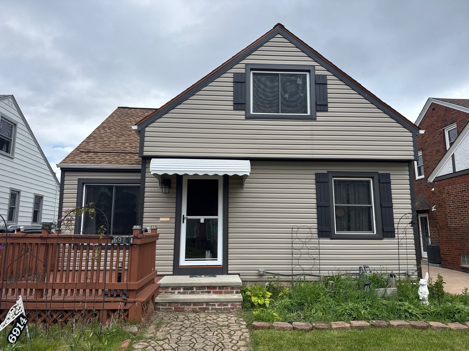 Full Exterior Siding and Awning Transformation in Parma by Cornerstone Roofing And Siding