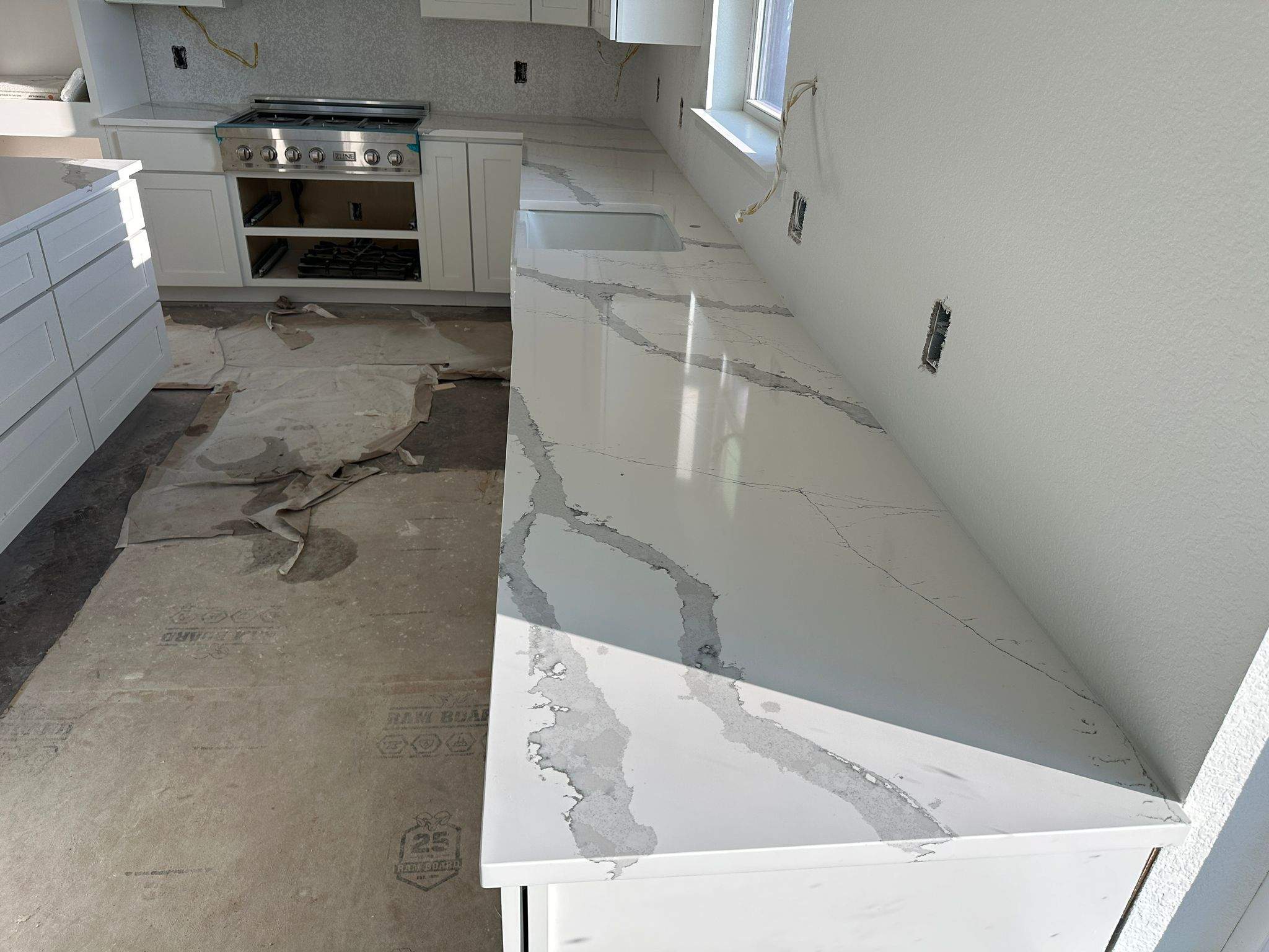 Kitchen and Bathroom Countertop Upgrades Featuring Gray Veined Quartz by Mena stone surfaces