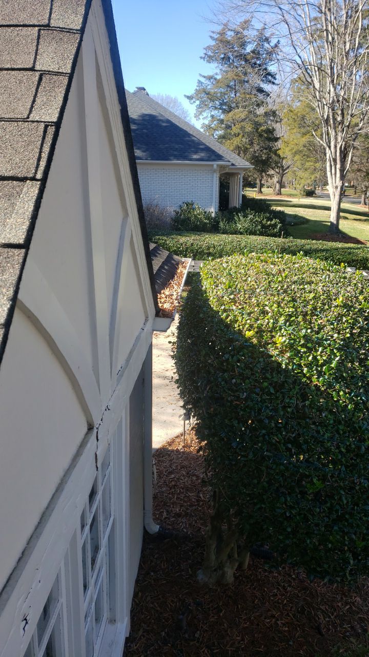 Sara Gutter cleanout using water by Power Wash Masters LLC