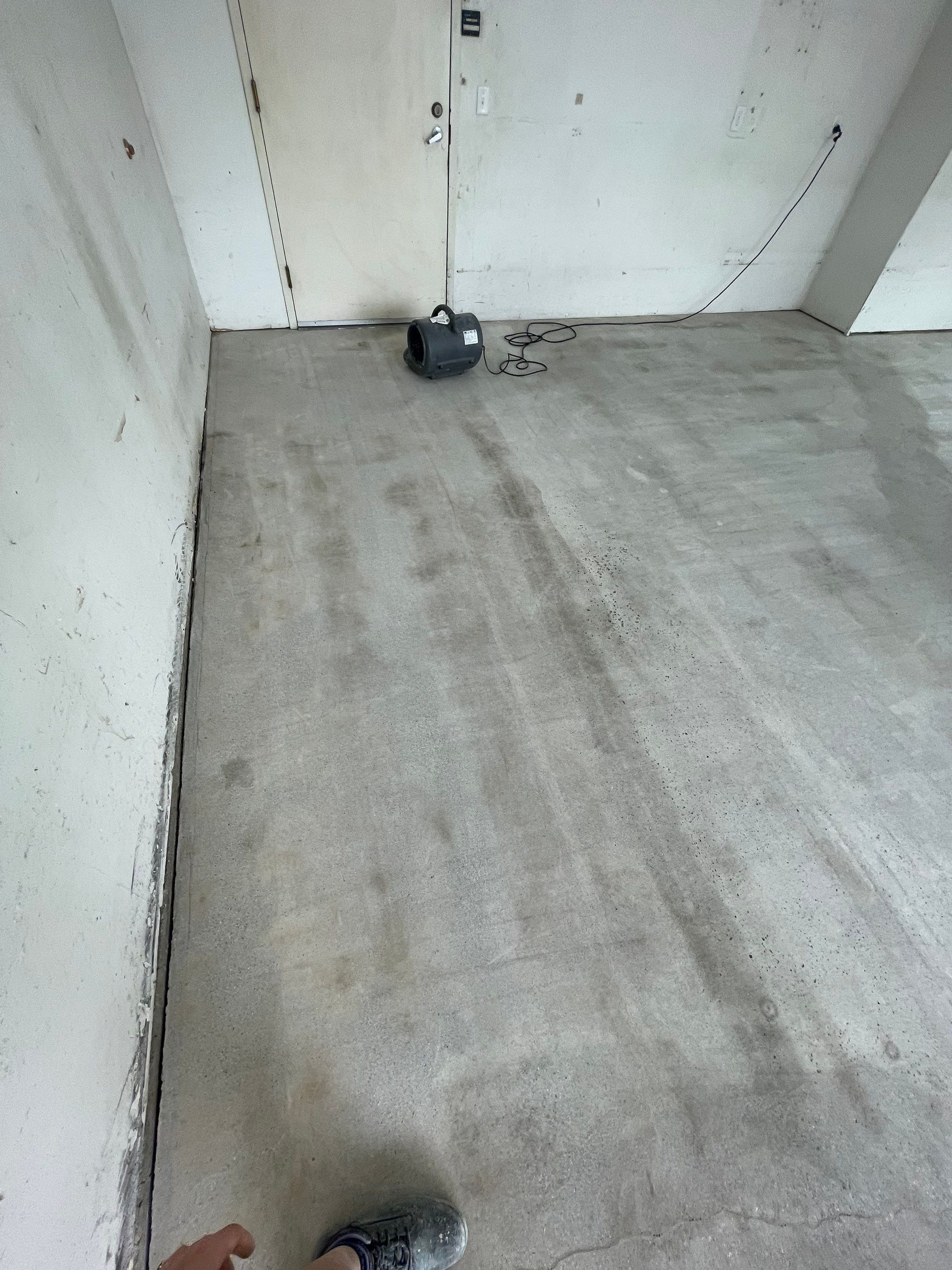 Coyote Flake Concrete Coating for Sioux Falls Garage by Select Painting, Coatings & Garage Cabinets
