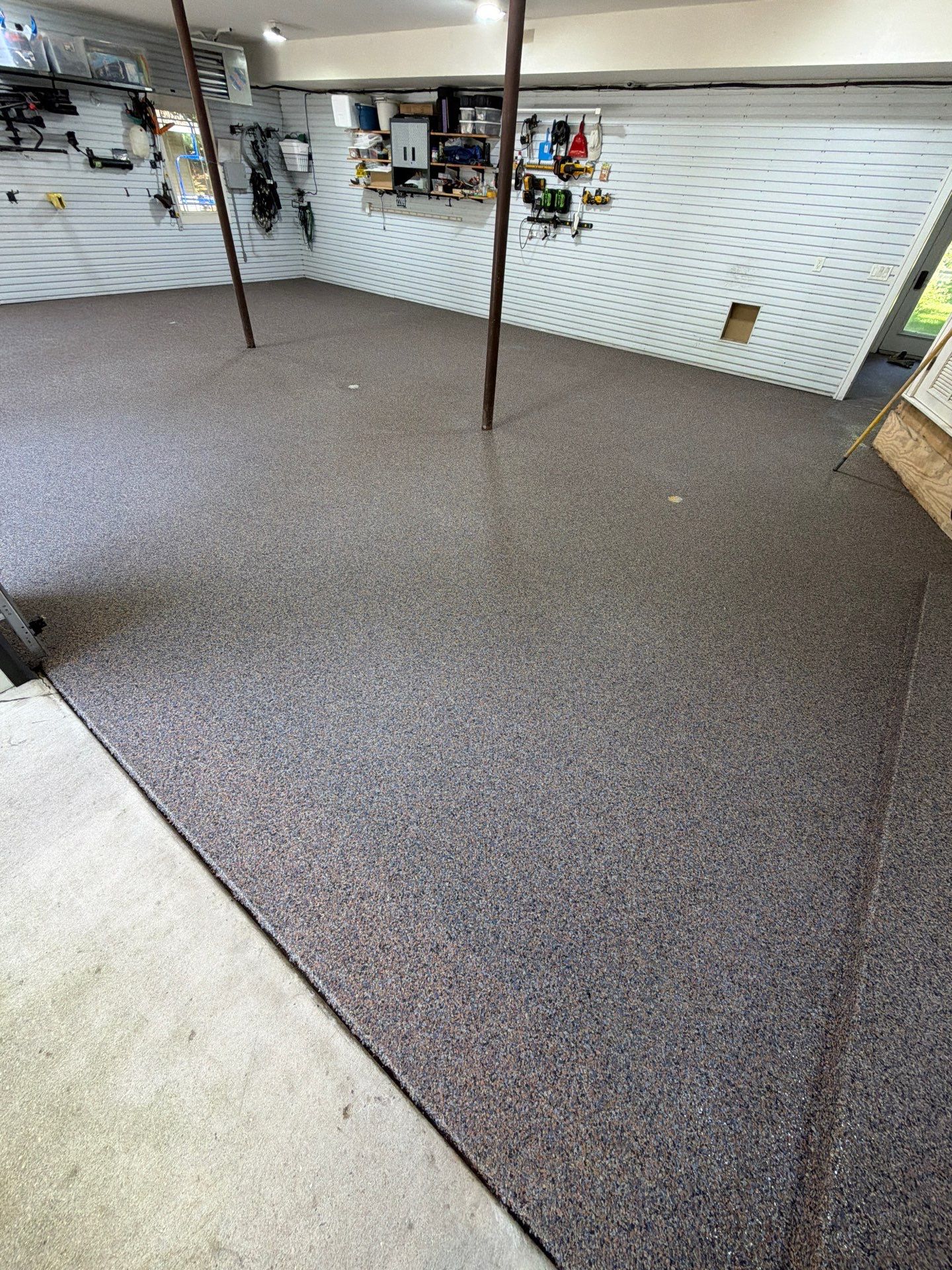 Residential Garage Epoxy Flake Floor Installation in Grand Haven by Gordon Painting