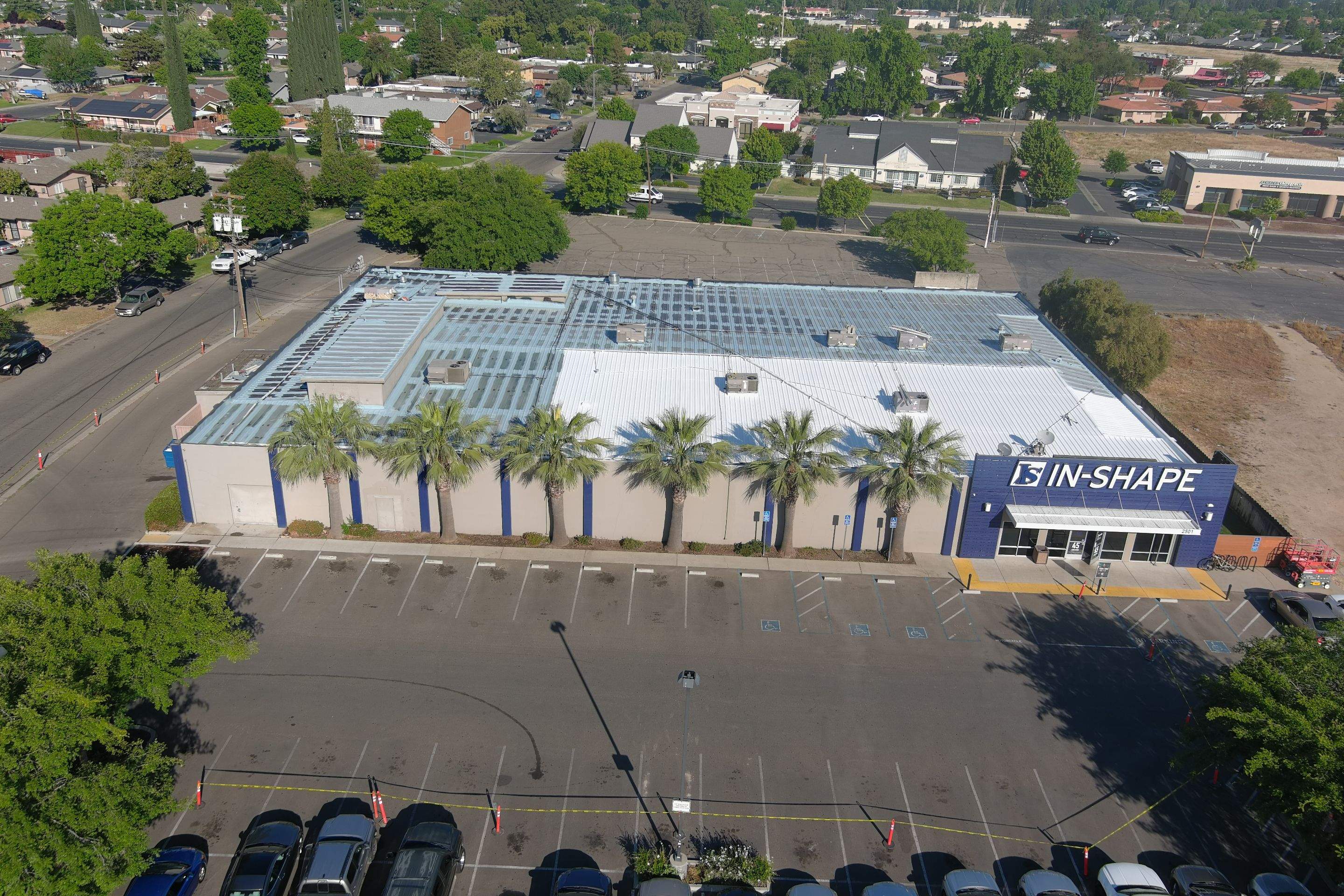 Metal roof restoration on commercial roof using Conklin Benchmark/ PUMA XL acrylic coatings over metal and foam by Straight Edge Roofing Inc
