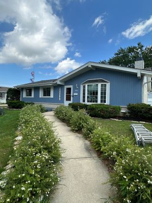 Blue Vertical Siding and Trim Installation in Milwaukee