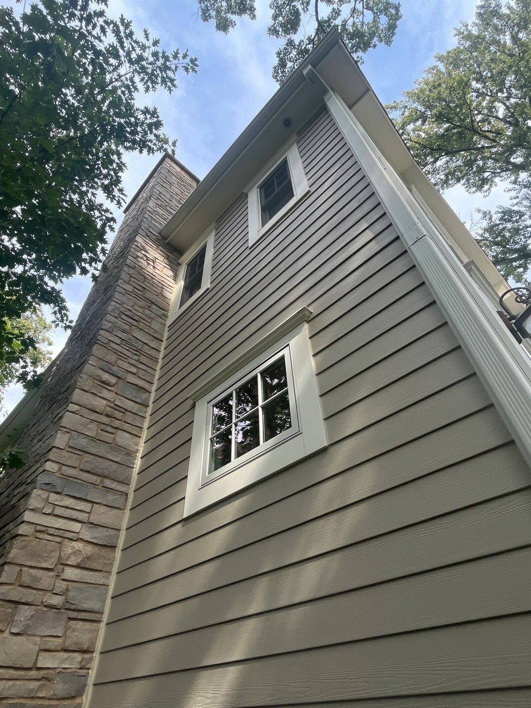Hardie Board House & Detached Garage Soft Washing by Northern Power Washing LLC.