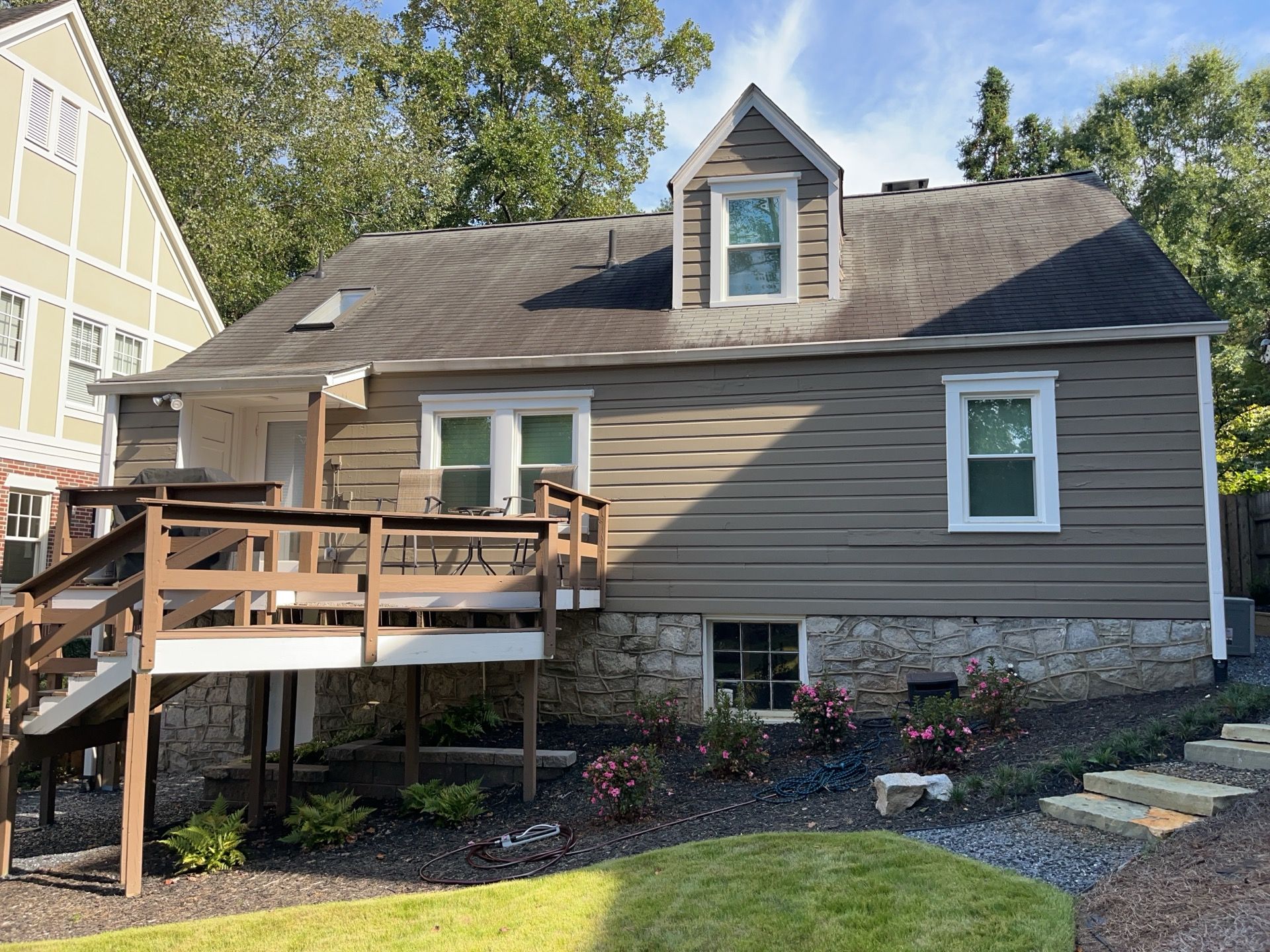 Full Siding Replacement, Deck Build, Exterior Paint, and Gutter Replacement by Nelson Exteriors