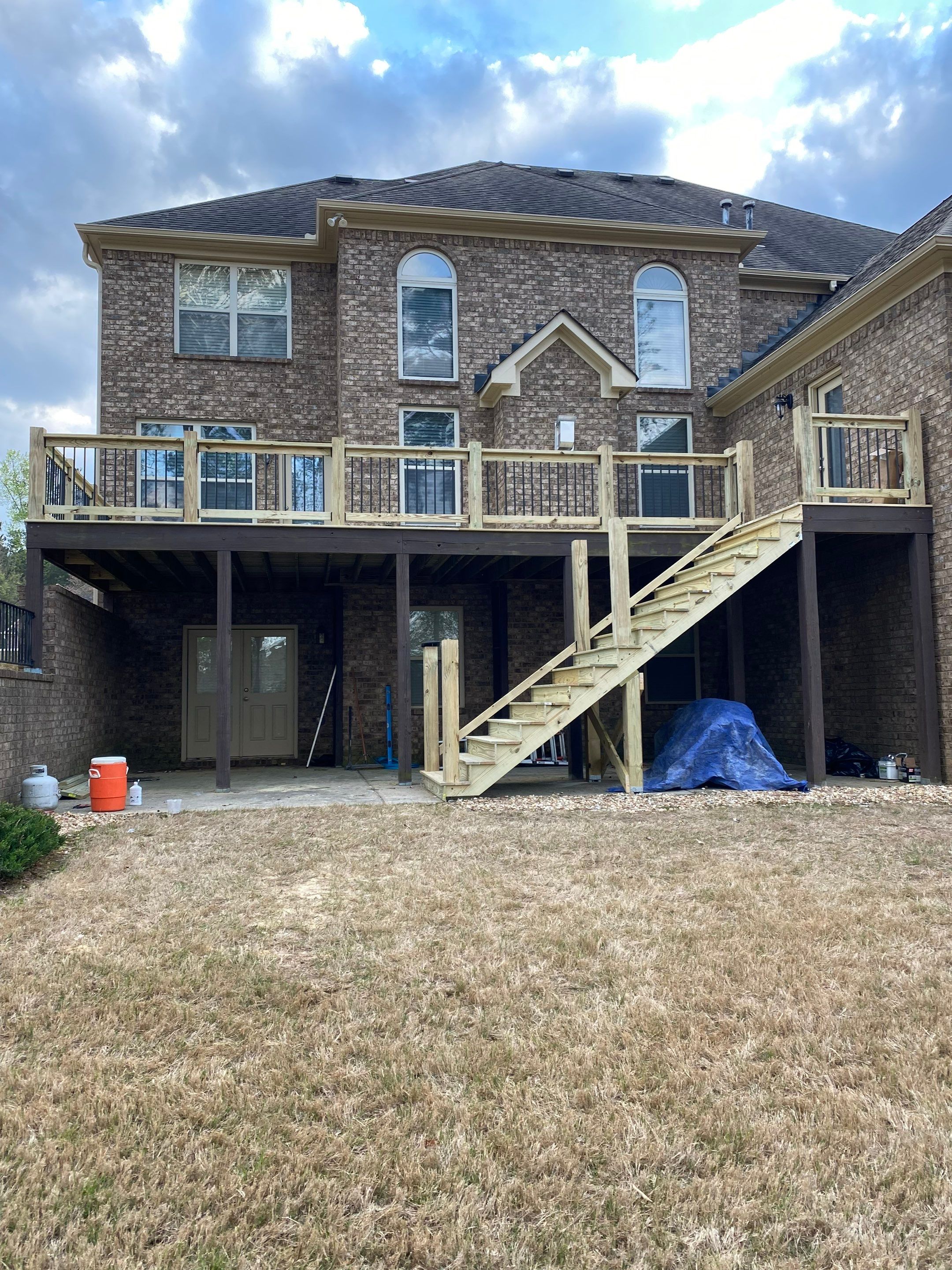 Elevated Pressure-Treated Wood Deck and Staircase in Hampton by Swift Home Renovations