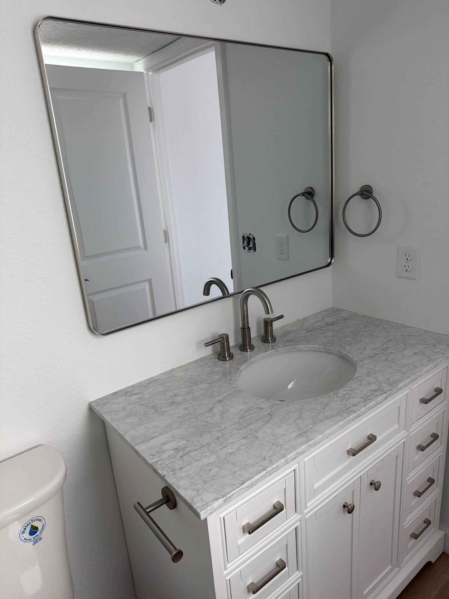 Full Condominium Remodel Featuring Aubrey Oak Flooring In Daytona Beach by Acies Renovations