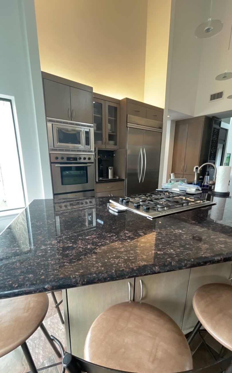 Modern & Clean Kitchen by SLM General Contractors & Roofing