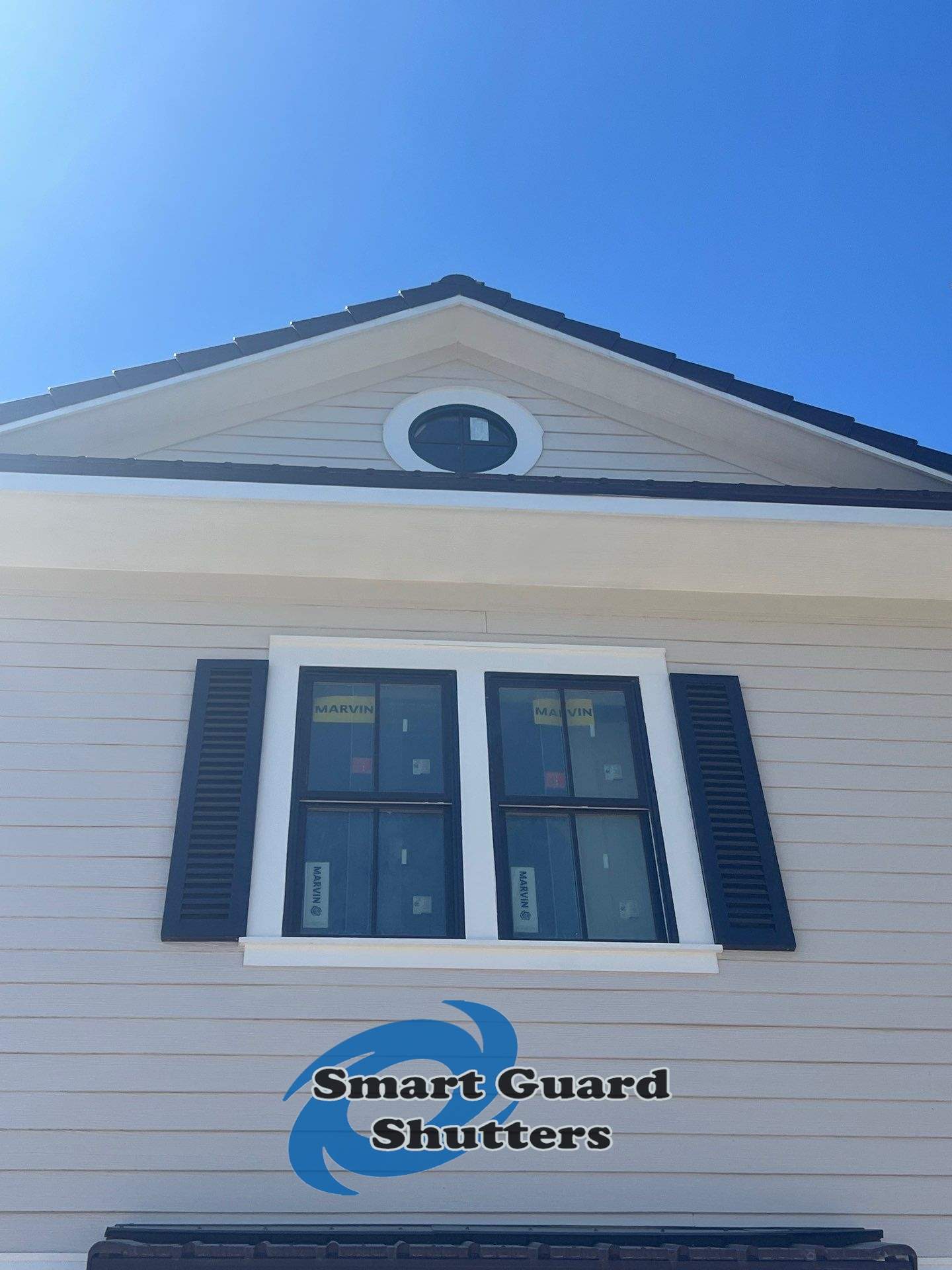 Decorative Colonial Shutters in Grey Brown by Smart Guard Shutters