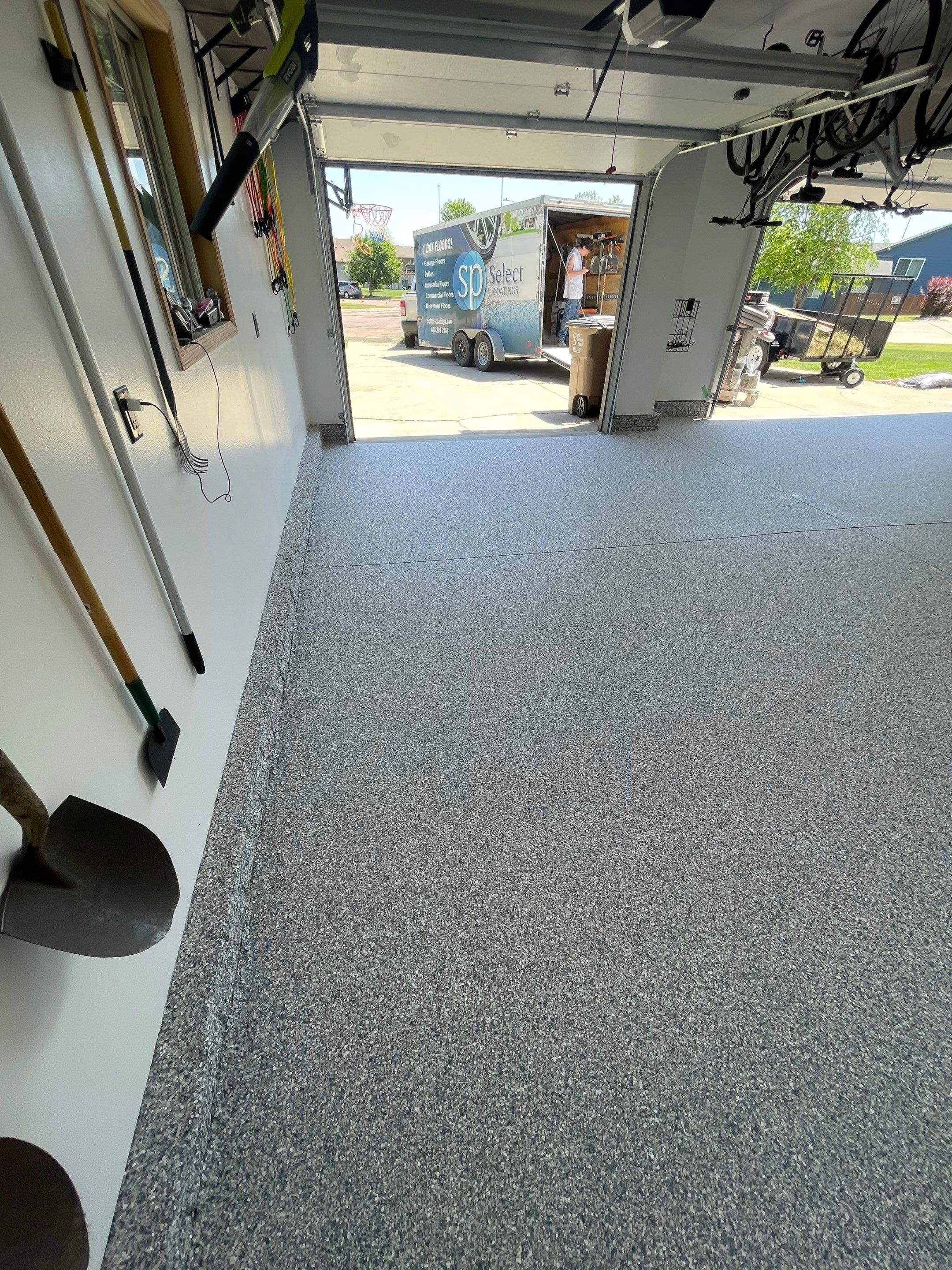 Tidal Wave Flake Garage Floor Installation in Sioux Falls by Select Painting, Coatings & Garage Cabinets