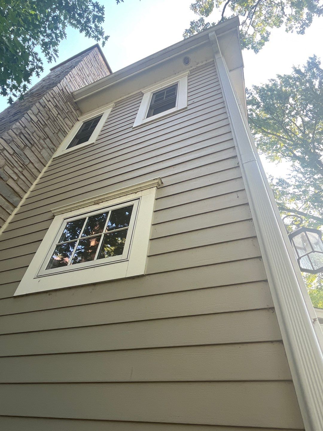 Hardie Board House & Detached Garage Soft Washing by Northern Power Washing LLC.