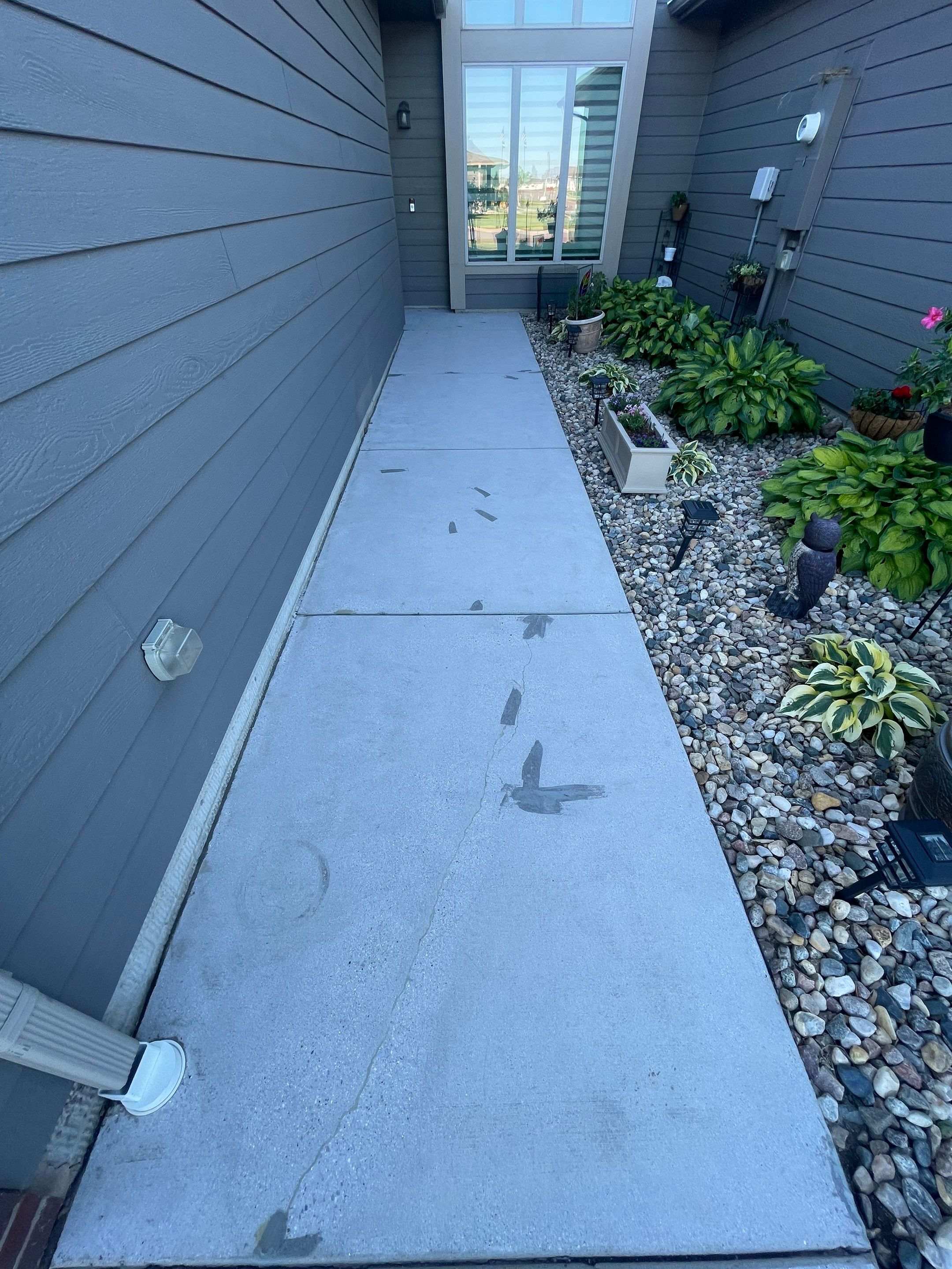 Custom Concrete Coating for Sioux Falls Patio and Front Walkway by Select Painting, Coatings & Garage Cabinets