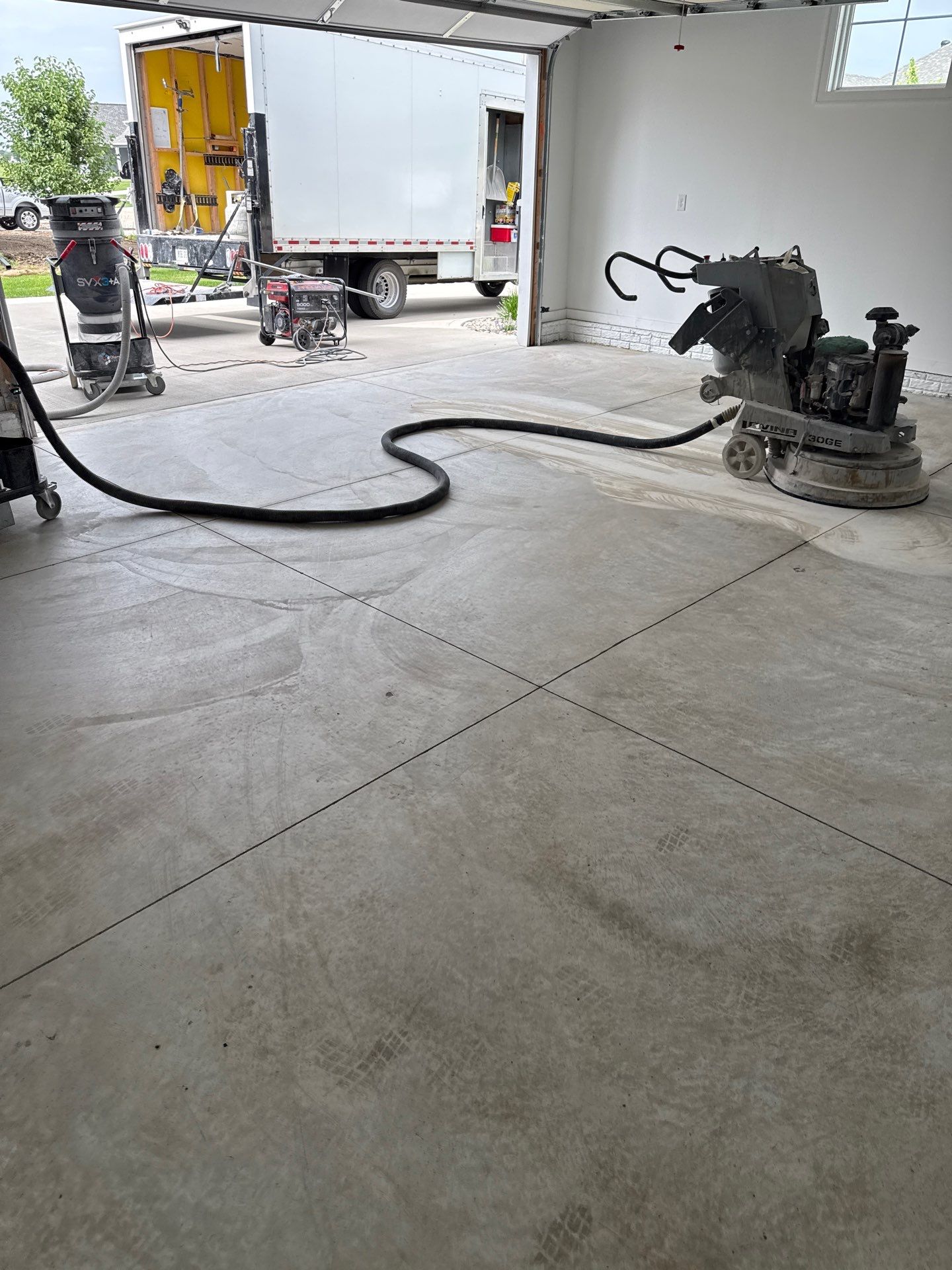 Gravel Flake Garage and Patio Floor Coating for Boone Residence by Revival Concrete Coatings