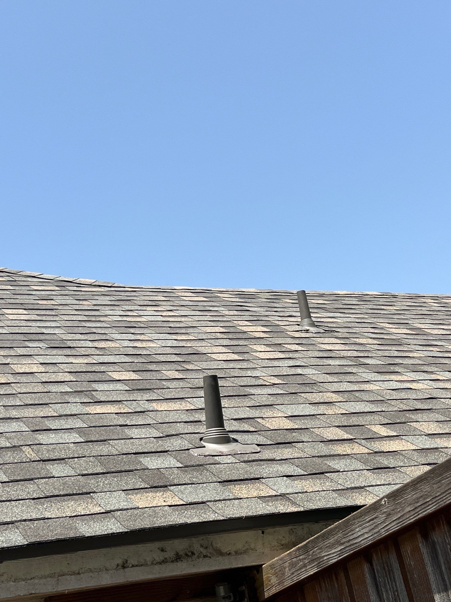 Red brick with IKO Cornerstone  by Tejas Roofworks + Restoration