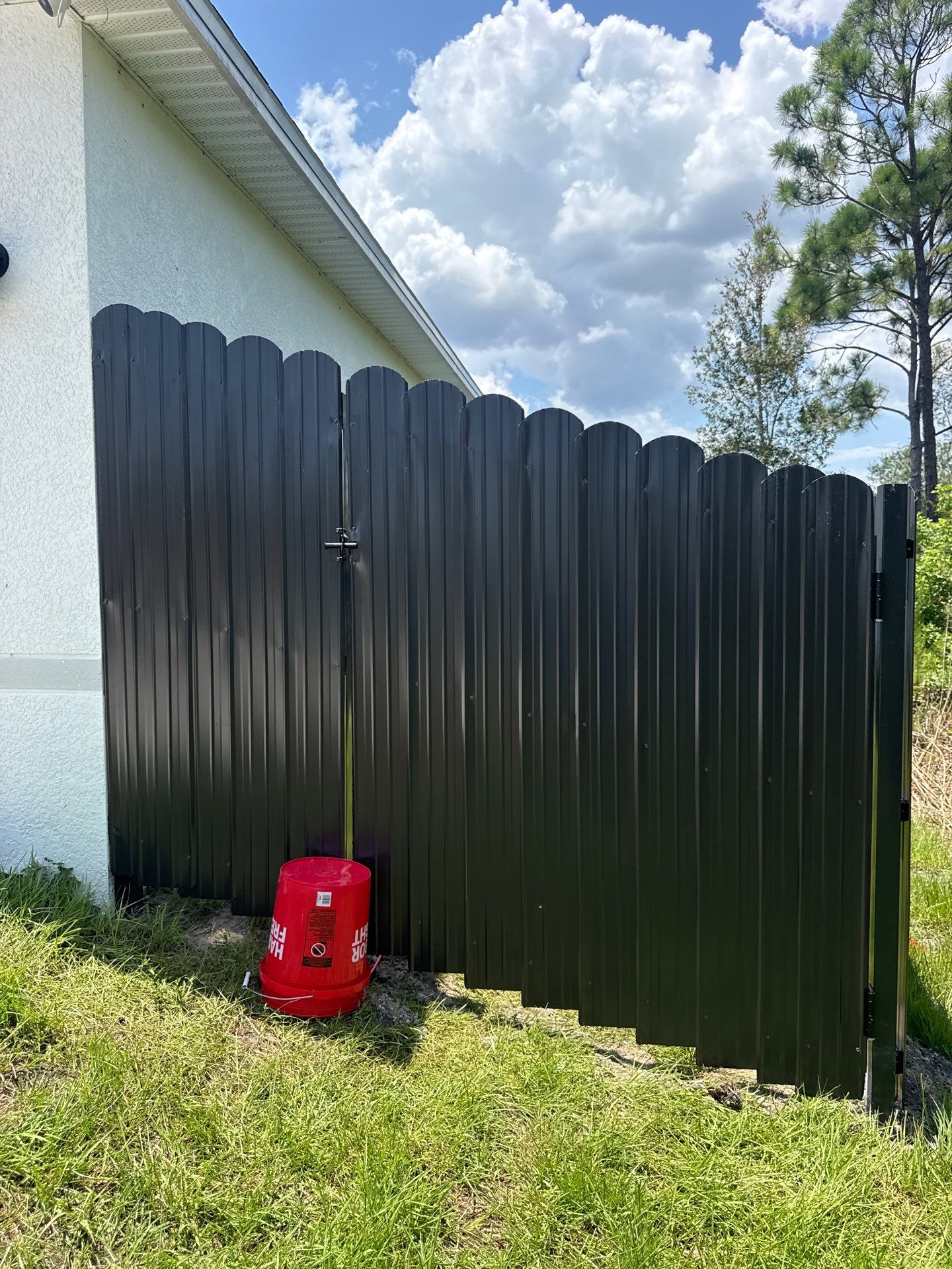 Black Scalloped Metal Privacy Fence Installation in Punta Gorda by True Fence LLC