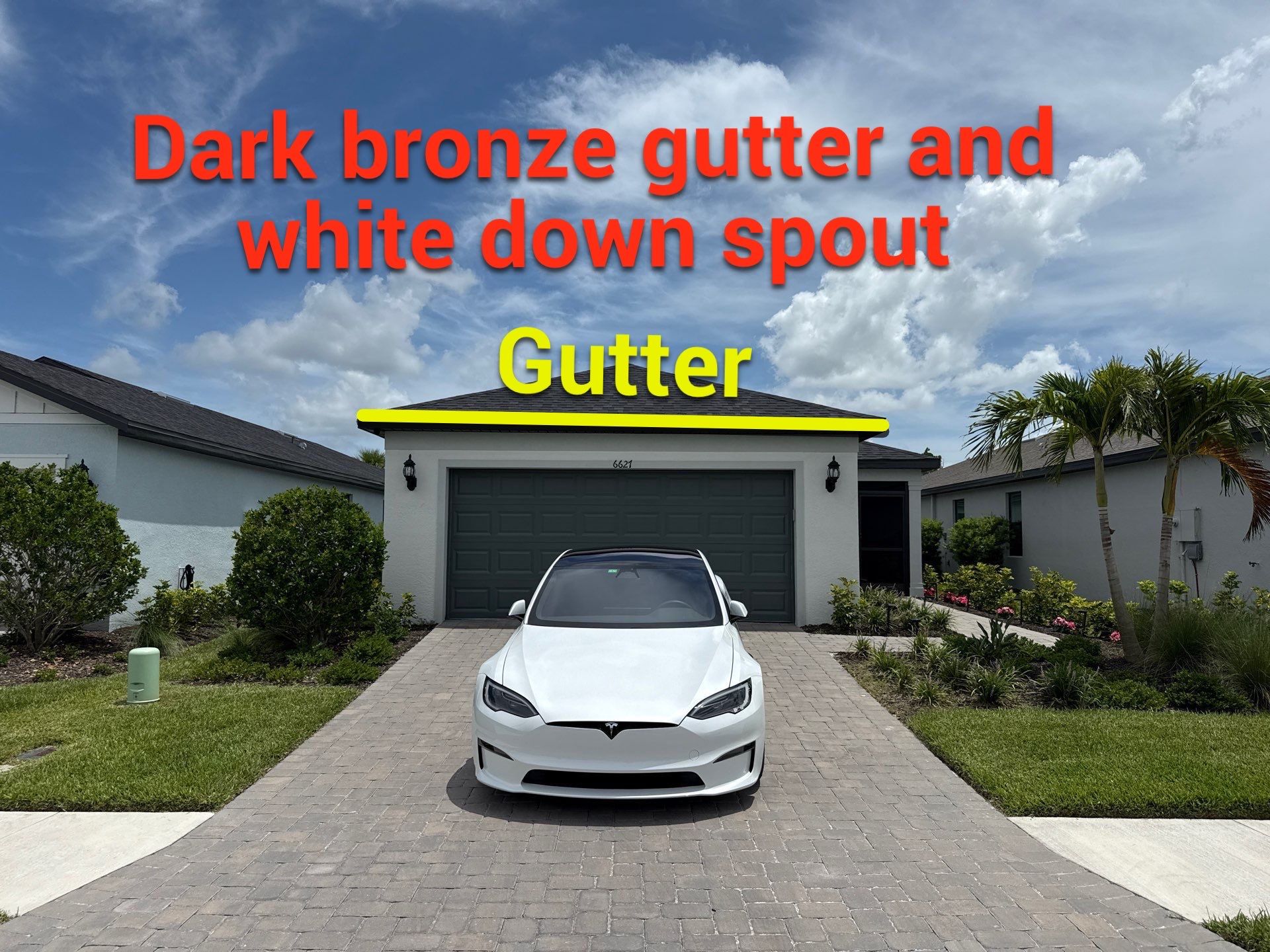 Dark Bronze Gutters and White Downspouts in Sarasota FL by Gutter Professors