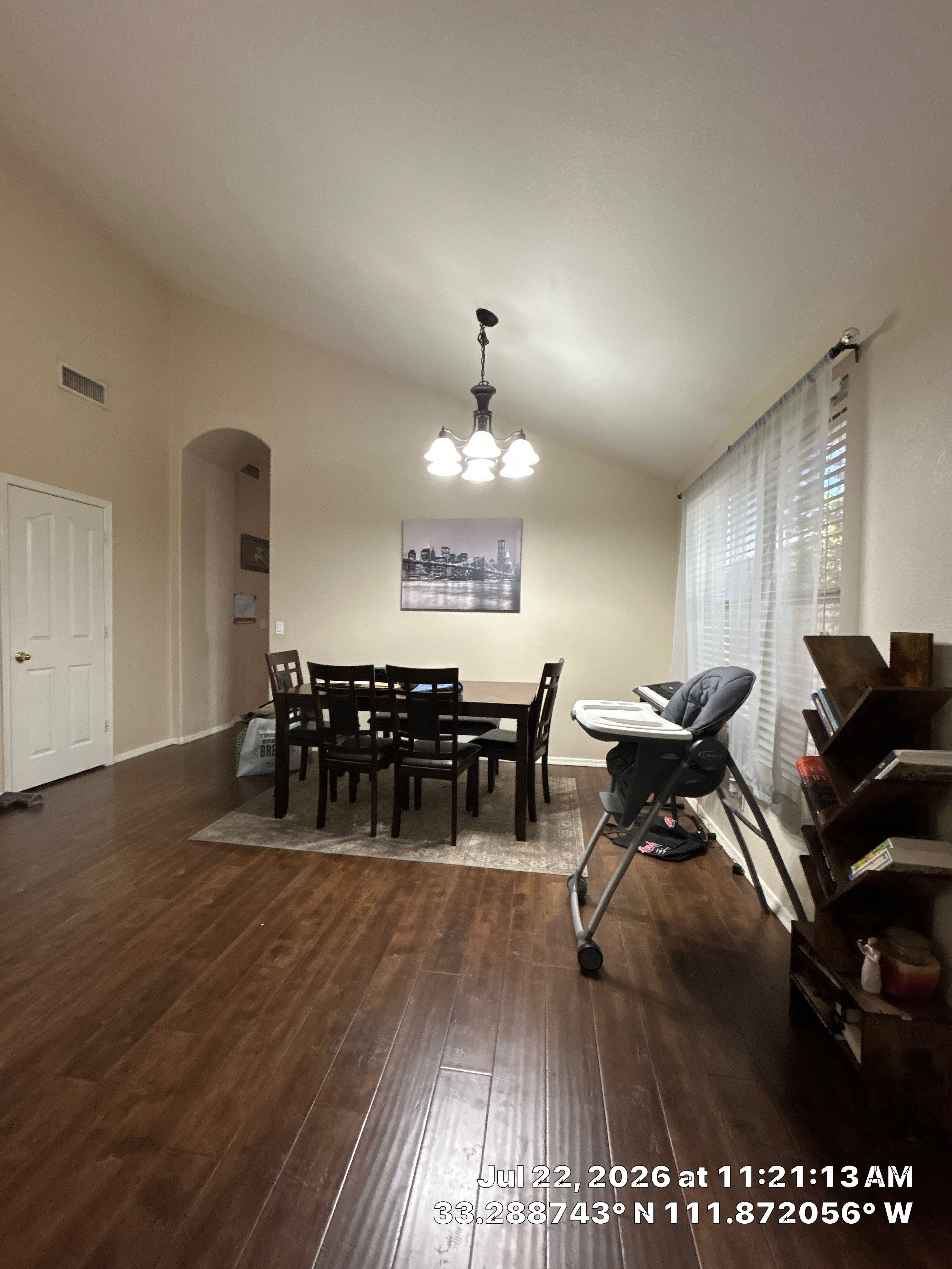 Chandler Dining Room Floor Remodel with Dark Wood-Look Laminate by CompanyCam Sales Demo