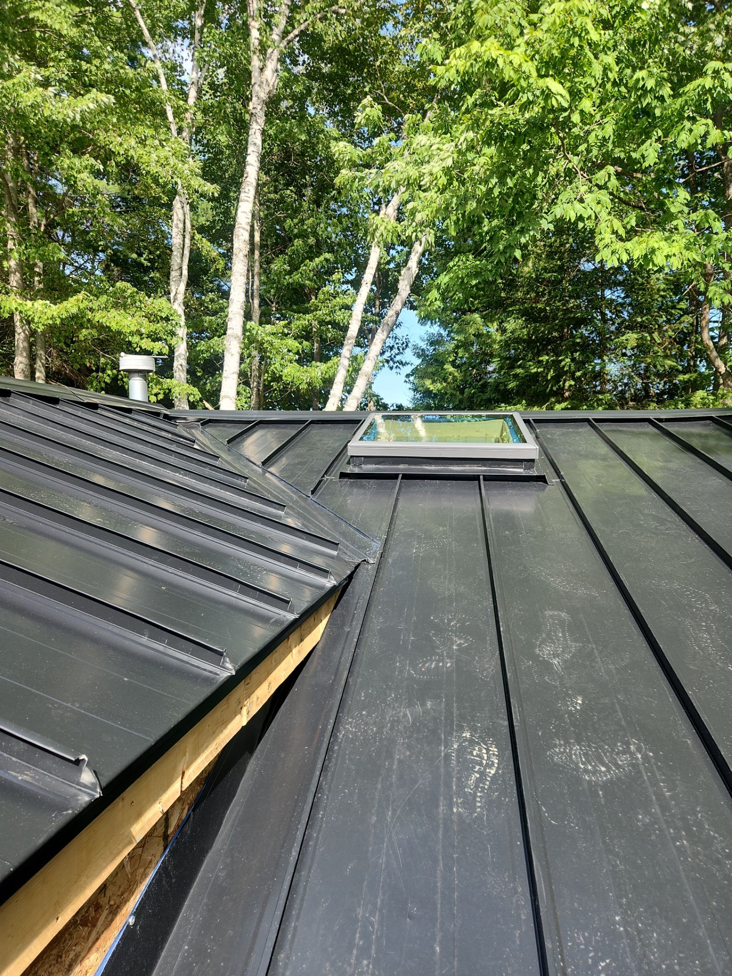 Roof Replacement using 16" Standing Seam Panels by Jay Carter Roofing & Sheet Metal