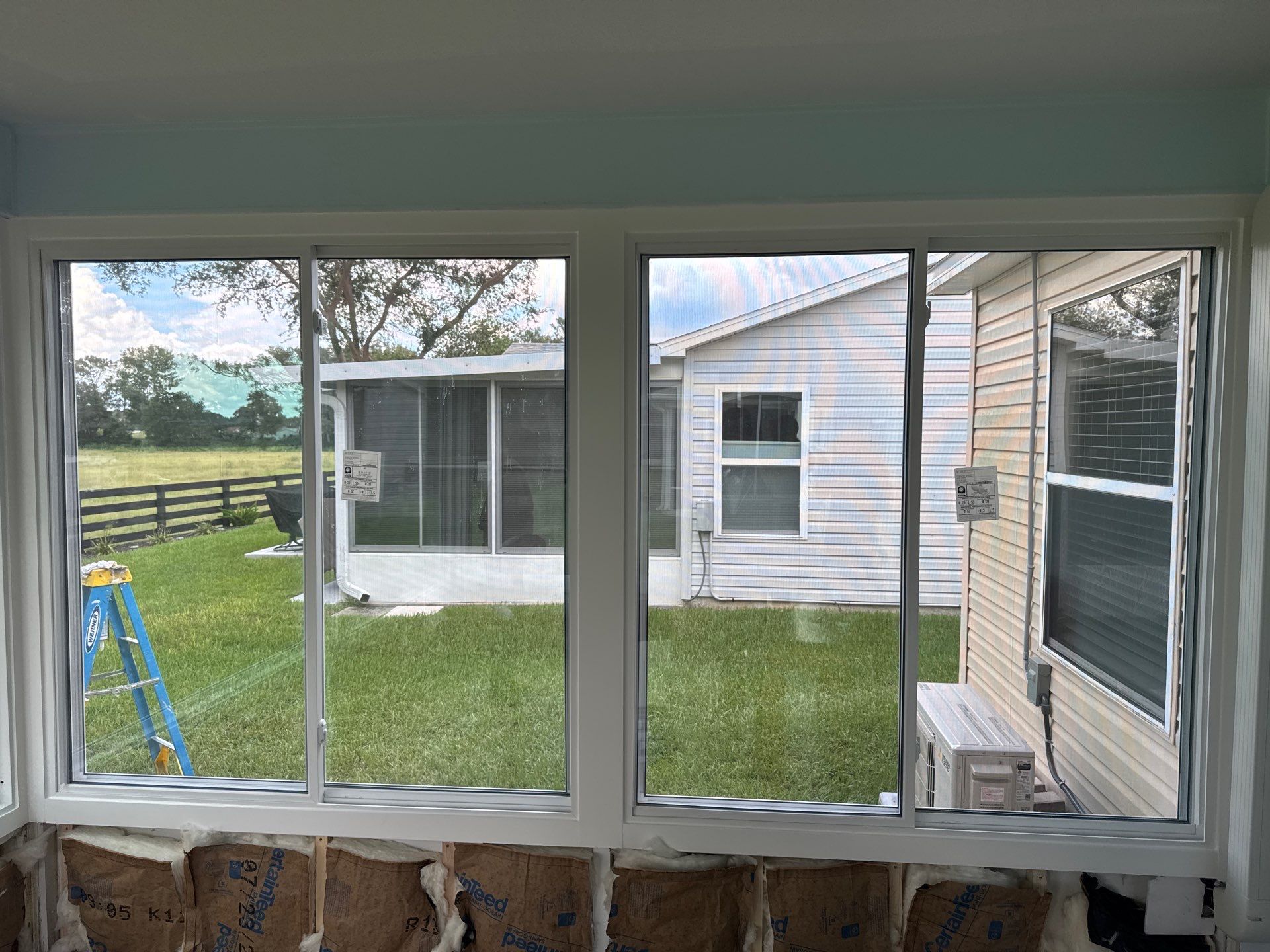 Sunroom Conversion with Alside Windows and Provia Door in The Villages by Windows & Doors Store