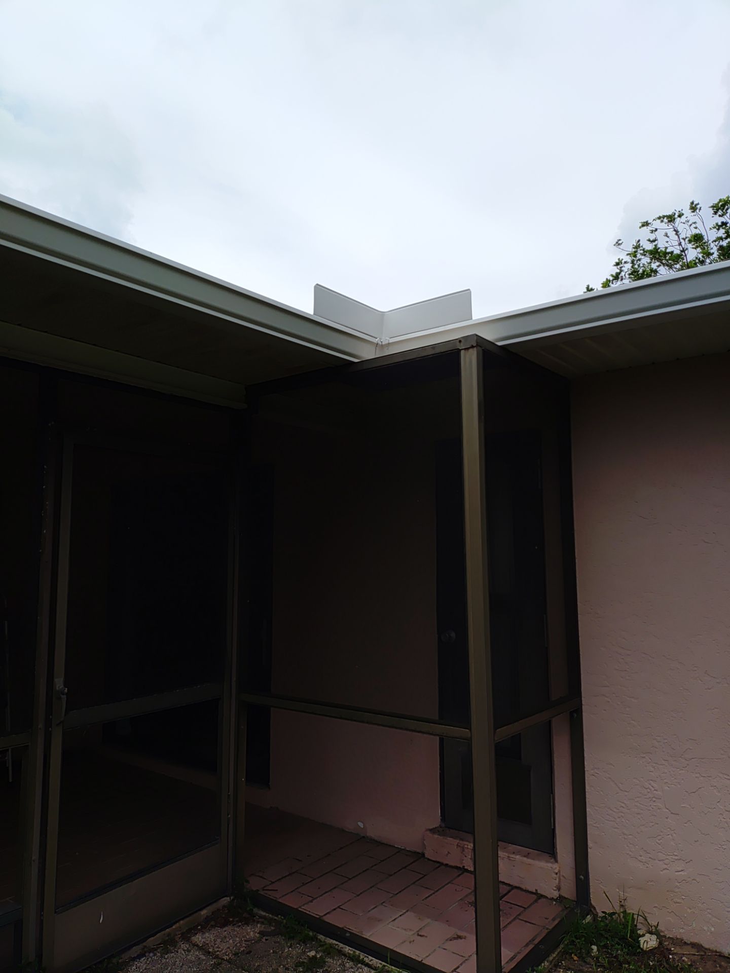 Replace gutter using White Down Spouts in Cape Coral FL by Gutter Professors