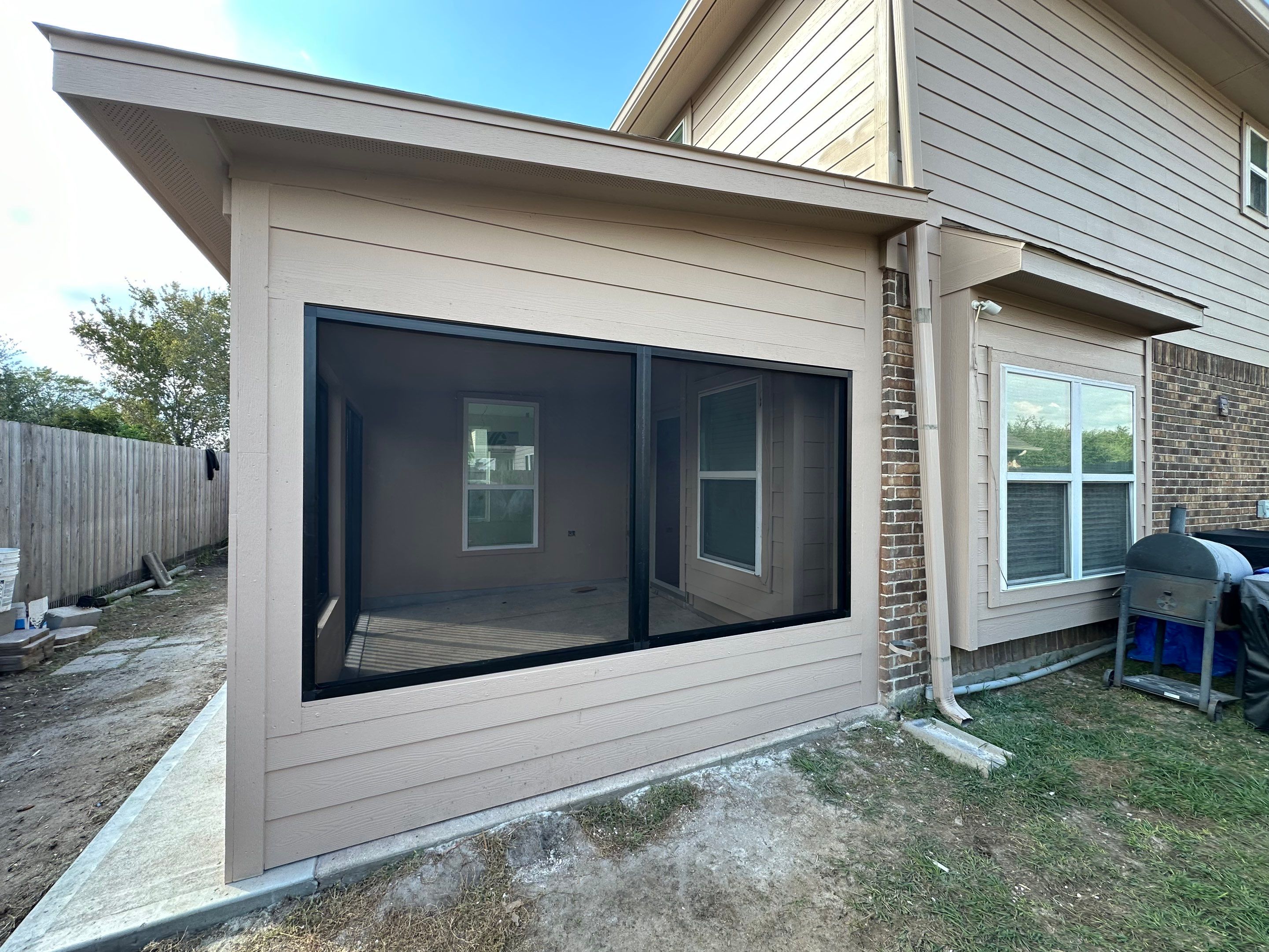 Project Case Review: Sunroom Addition, Patio Integration & Drainage Upgrade by Texas Urban Elements
