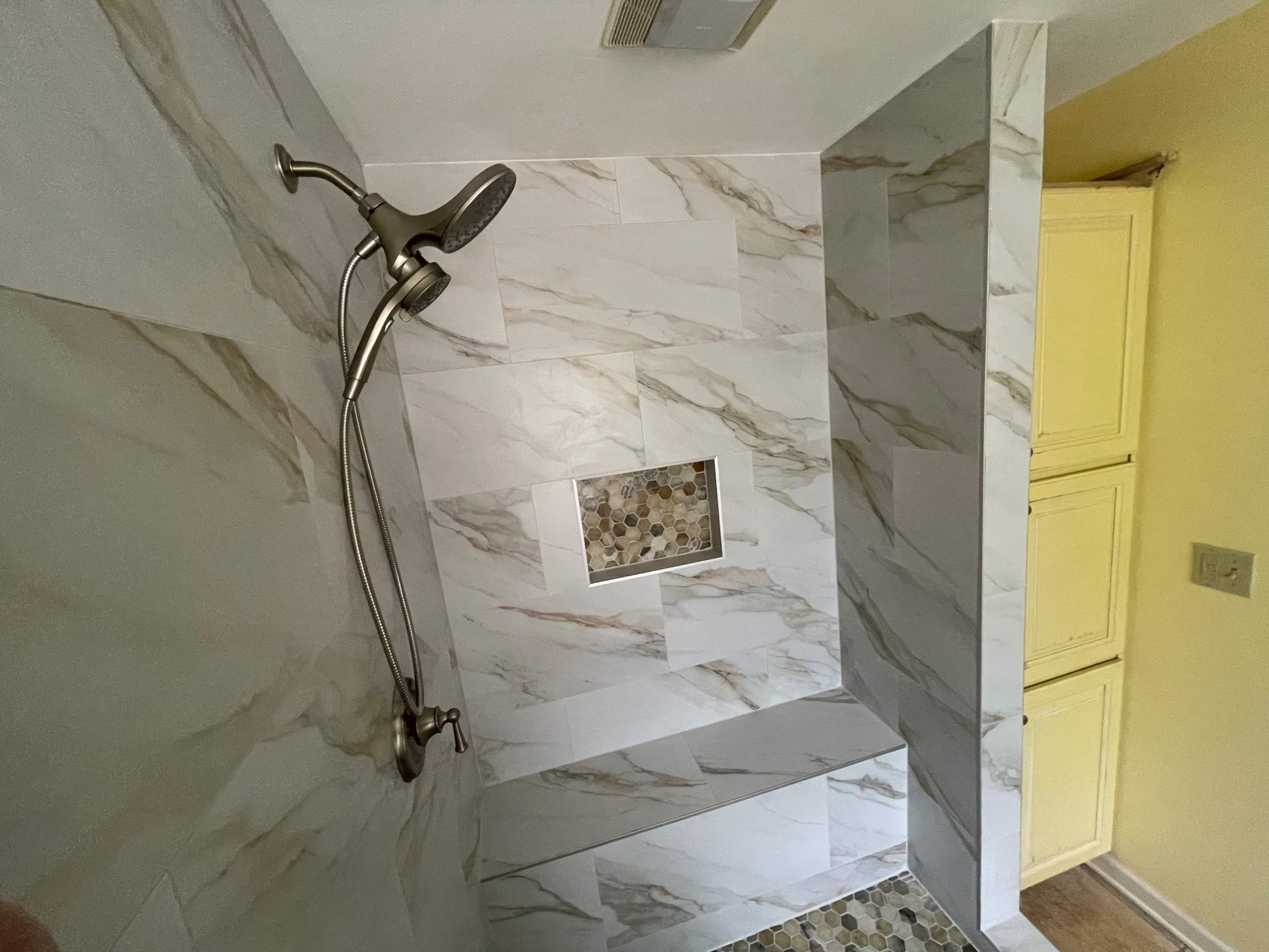 Master bathroom shower renovation, and tile flooring by Prudencio