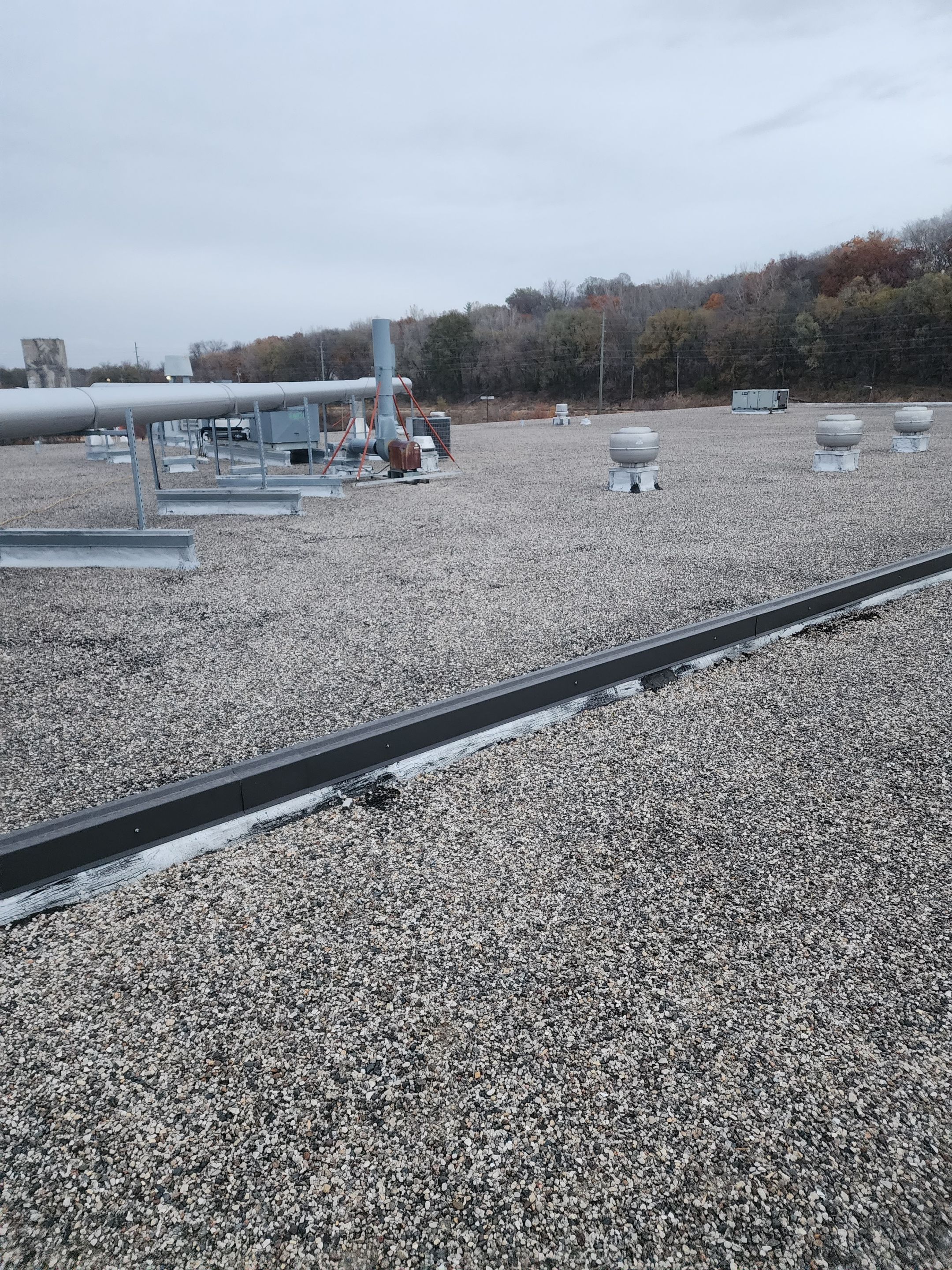 AML Riverside  by Grell Roofing, LLC