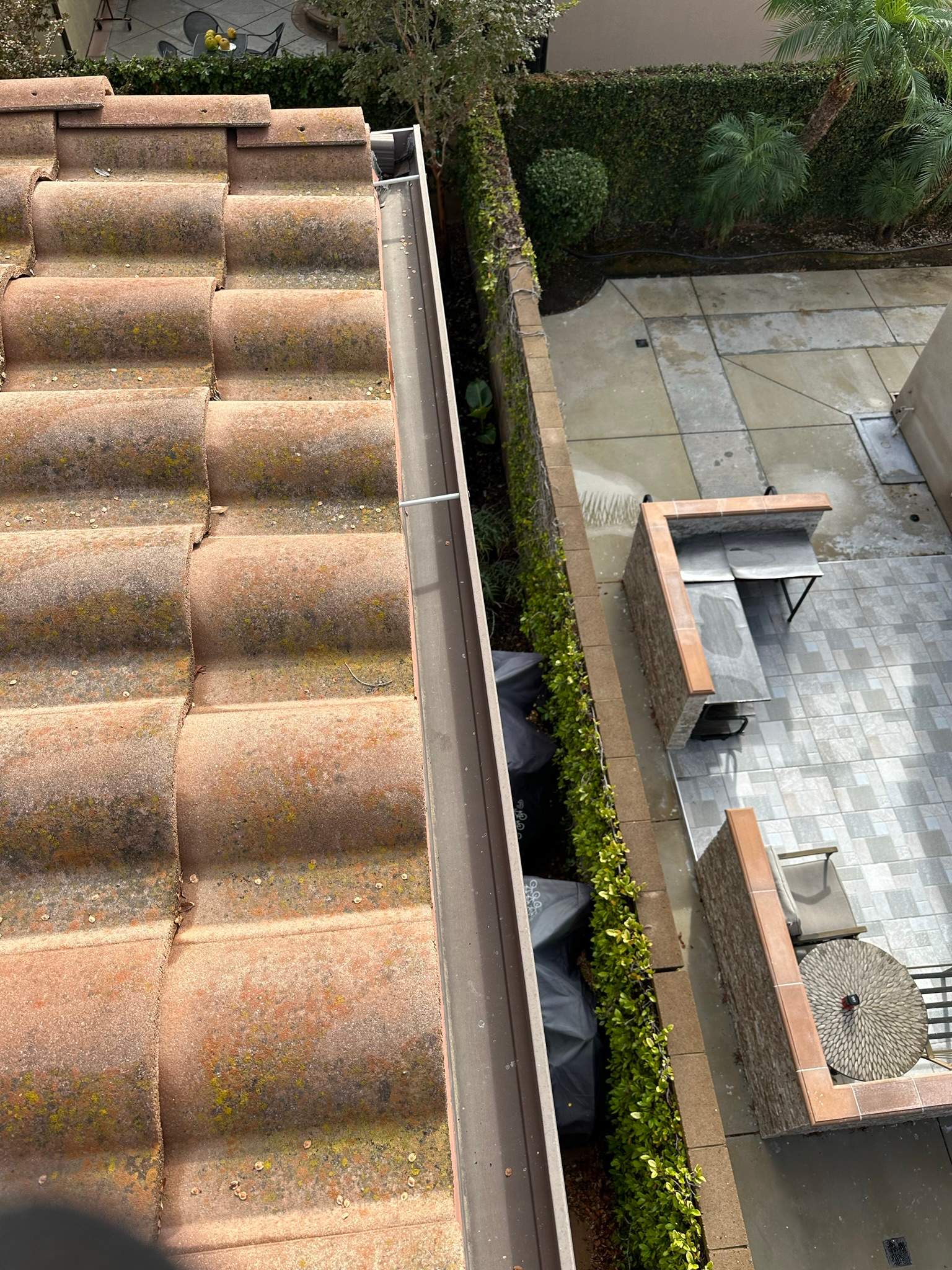 Clogged gutters at this Irvine home in Woodbury by Property Cleaning Experts