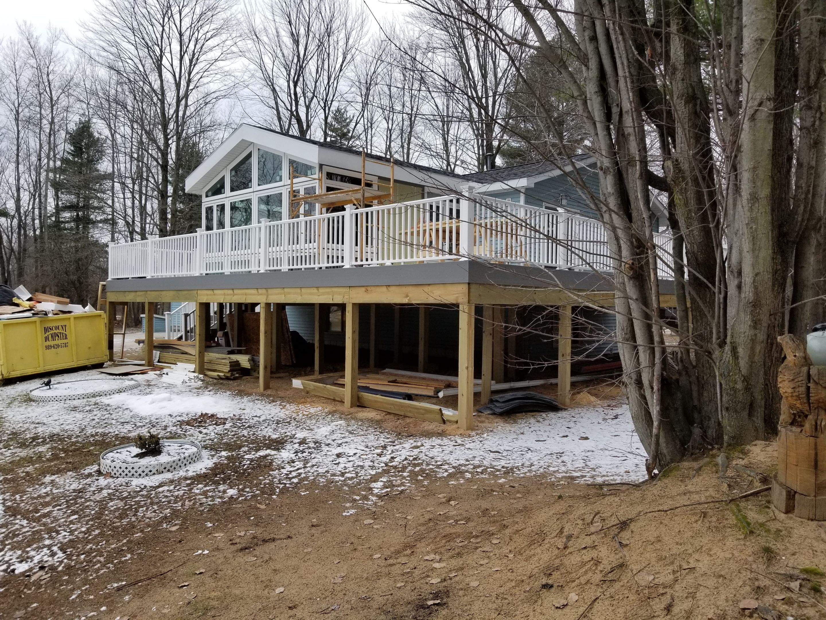 Sunroom and deck addition. by Energy Plus Home Improvements