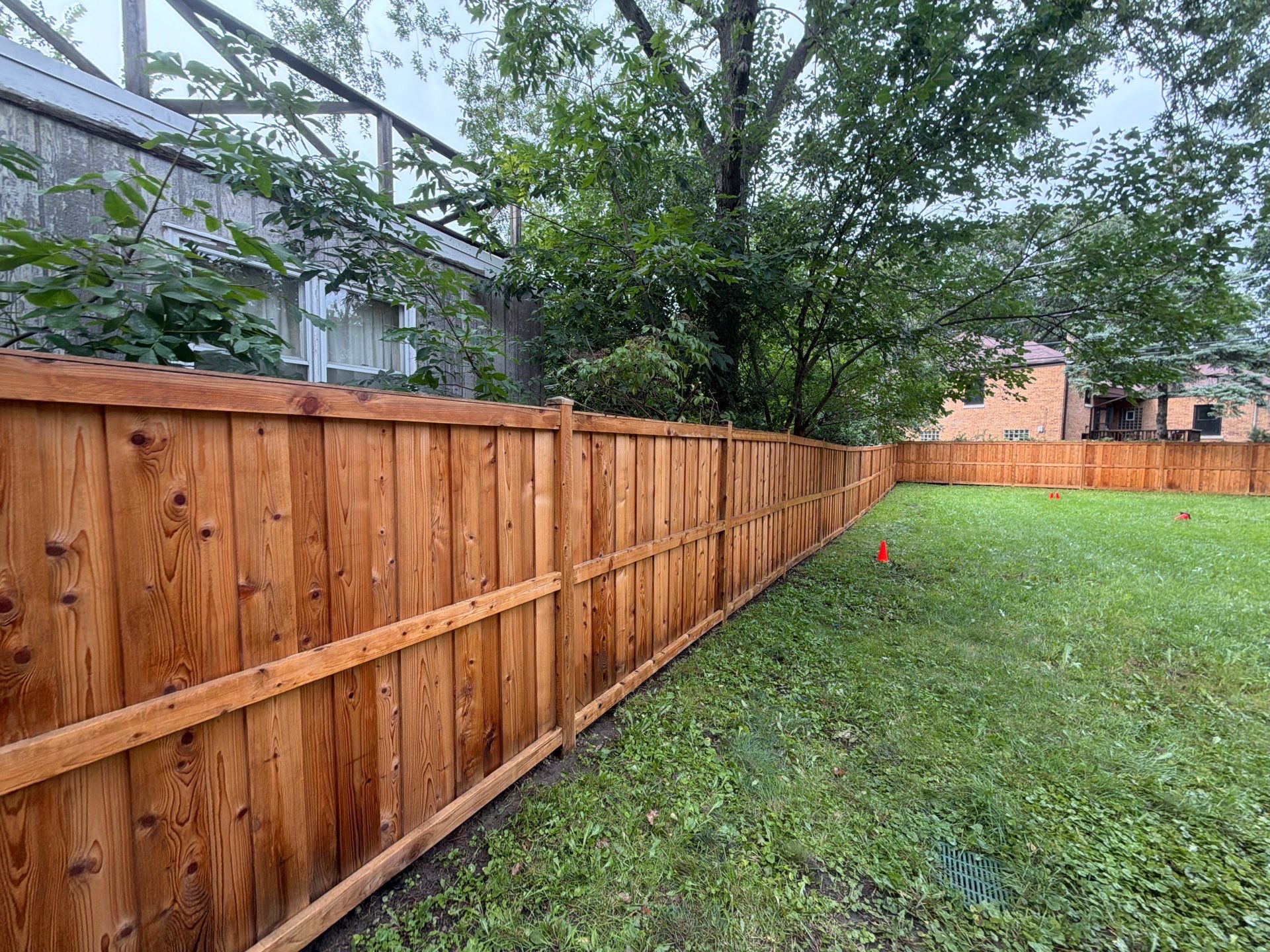 Wood fence cleaning and sealing by Northern Power Washing LLC.
