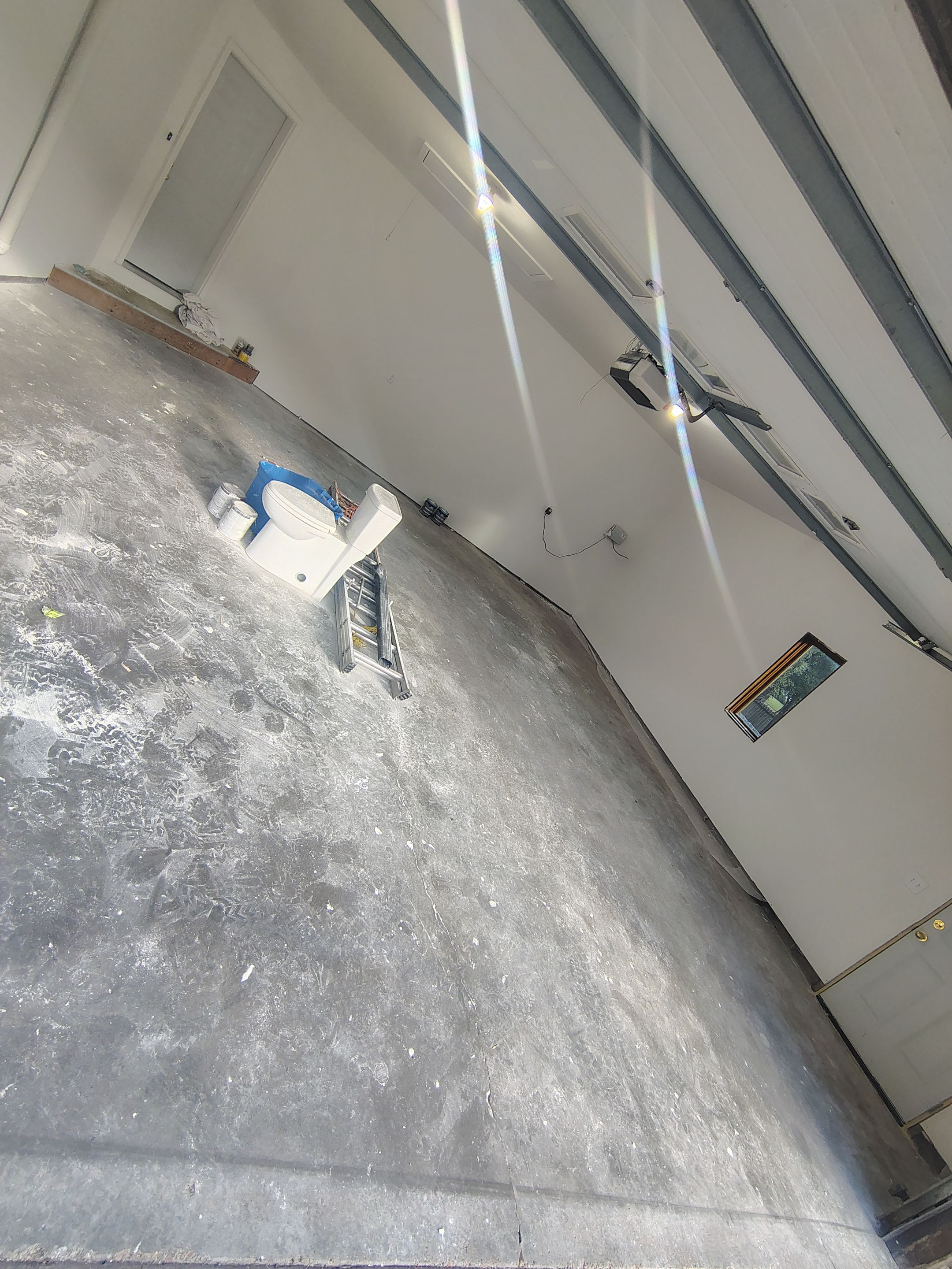 Sioux Falls Garage Floor Coating with Speckled Flake Finish by Select Painting, Coatings & Garage Cabinets