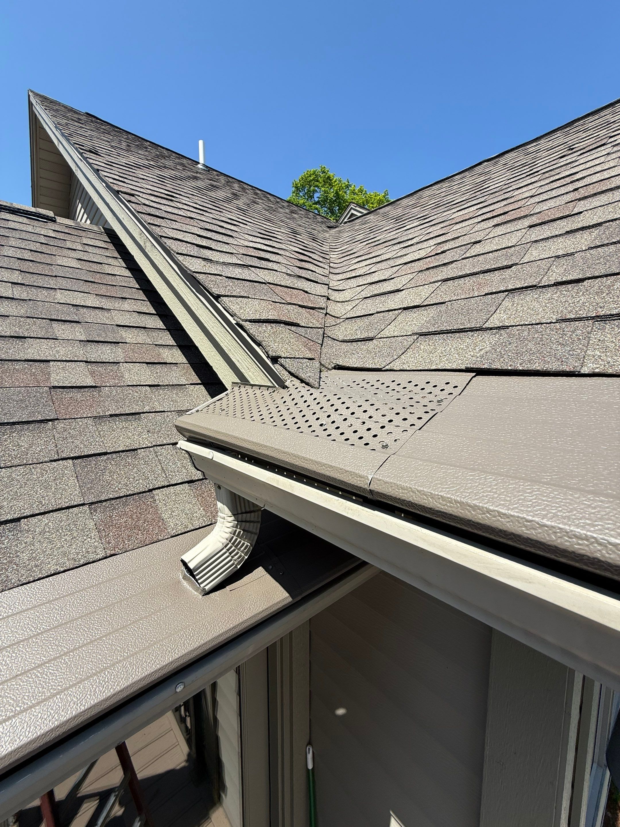 Custom Gutter Helmet Protection for Residential Roof in Suttons Bay by Rainbow Seamless Systems
