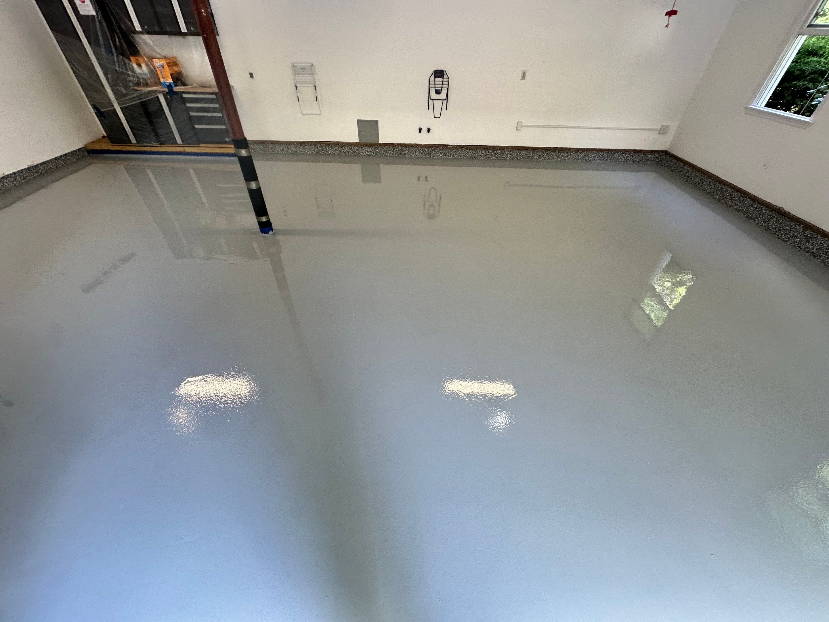 Wombat Concrete Floor Coating Transformation by DiGiorgi Roofing and Siding Inc