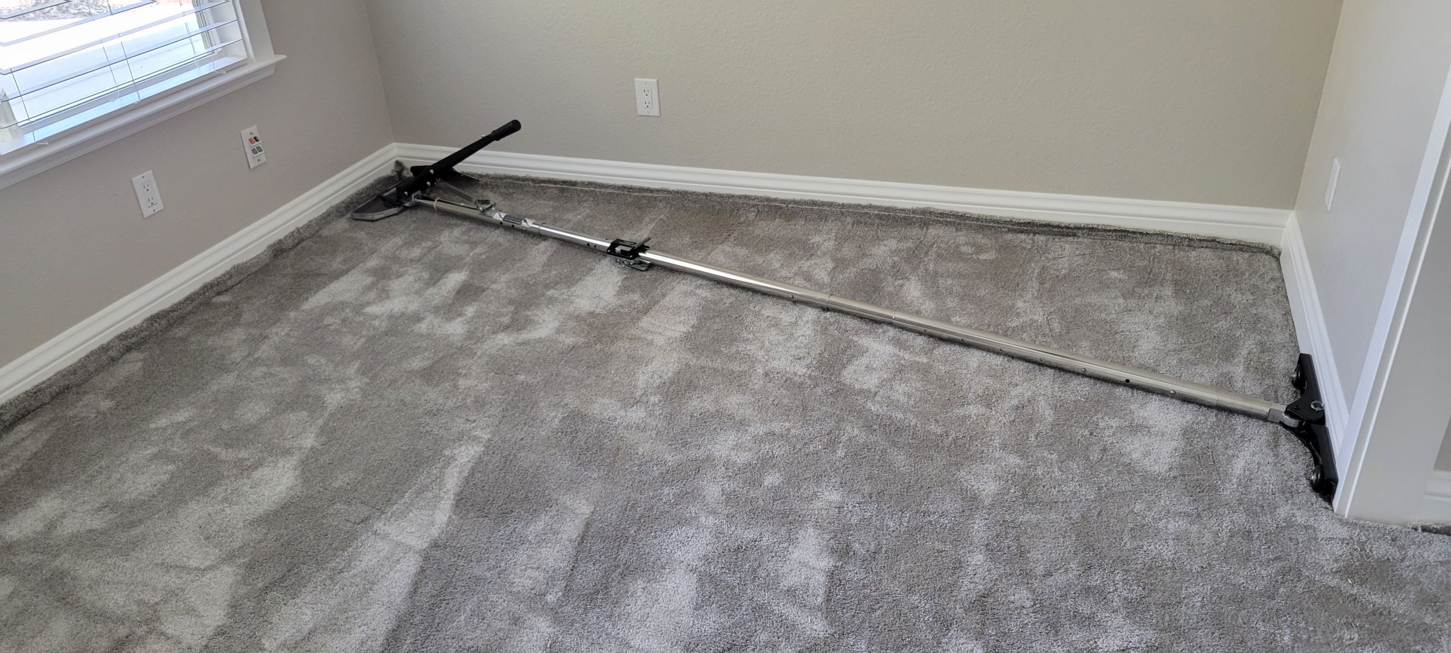 Stretching Out a Buckled Carpet by Ardent Carpet Restore LLC