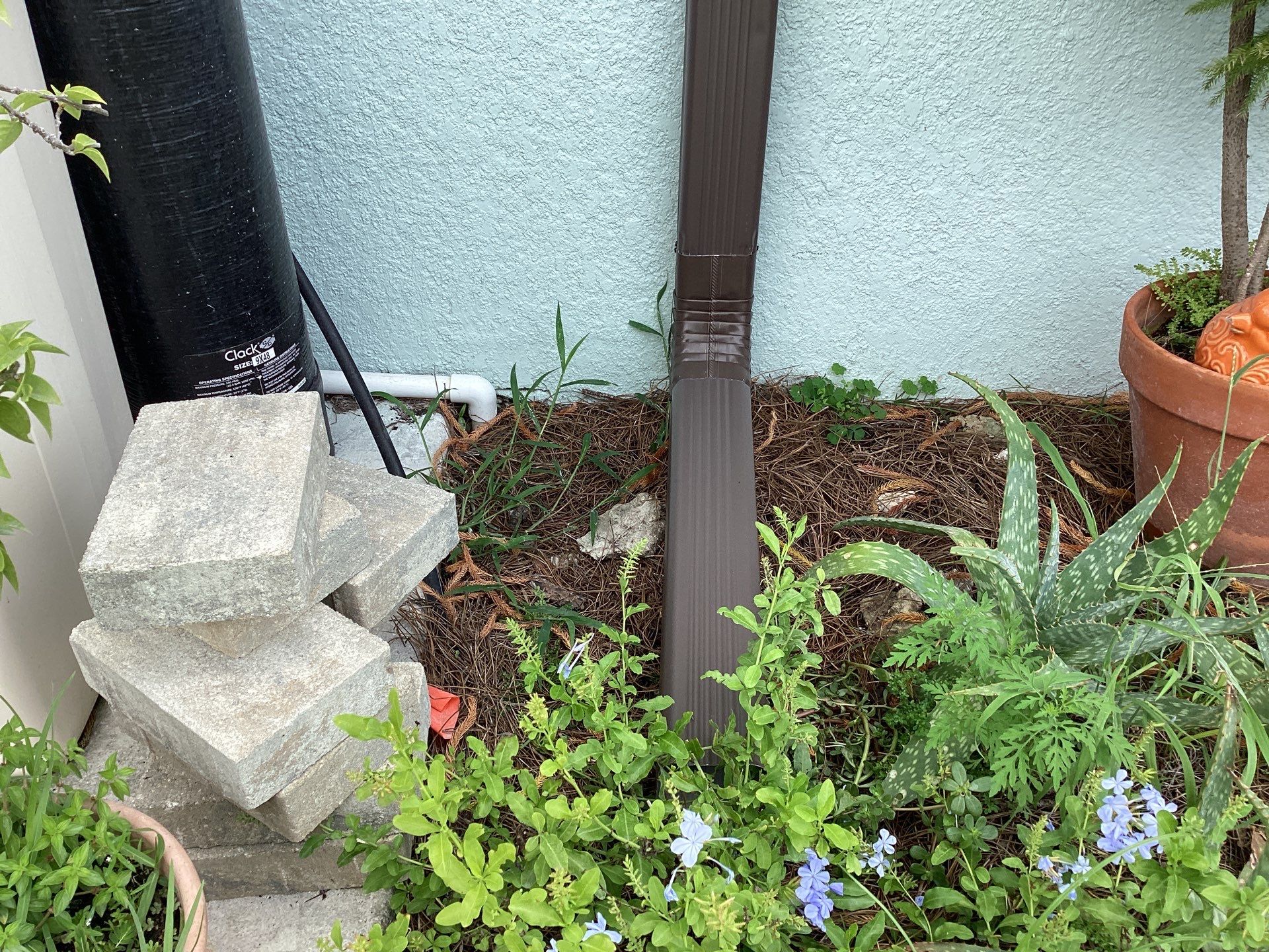 Musket Brown and New Downspouts in Lehigh Acres, FL  by Gutter Professors