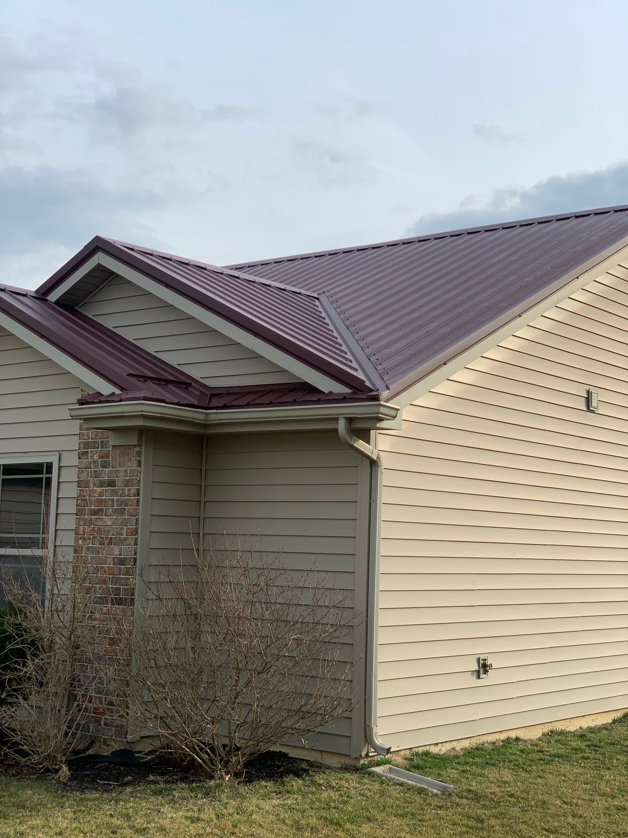 Burgundy Exposed Fastener Metal Roof in Columbia City, Indiana Country Home by 4Ever Metal Roofing