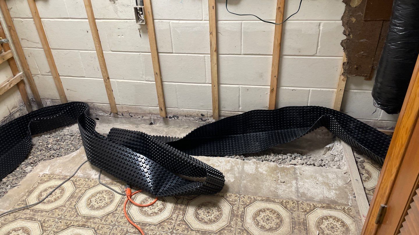 Drain Tile, Sump Pump & Buried Discharge in Columbia Heights by Waterproofing Northeast