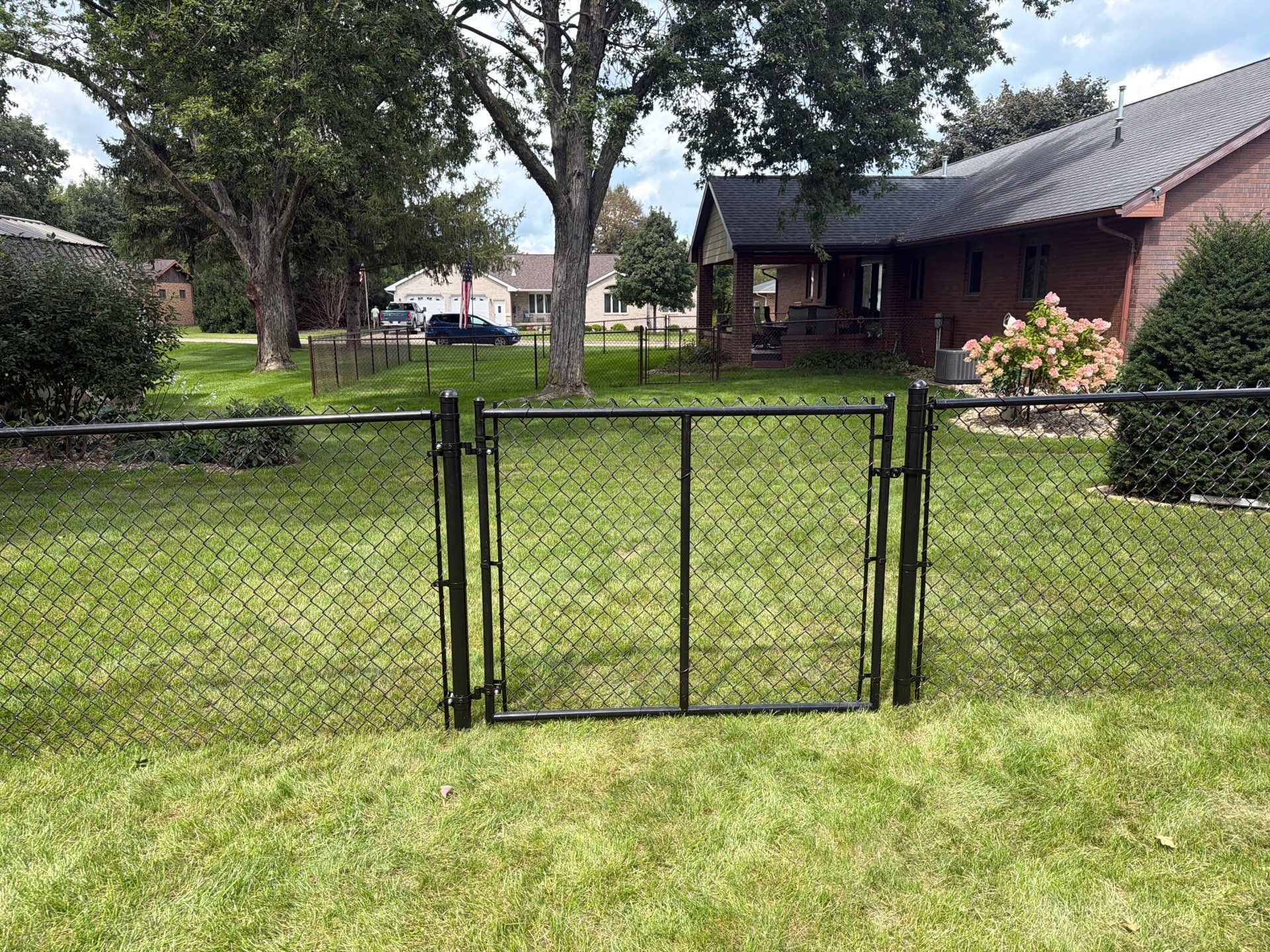 Residential White Vinyl Privacy and Black Chain Link Fencing in Jesup by Perfect Picket Fence and Stain
