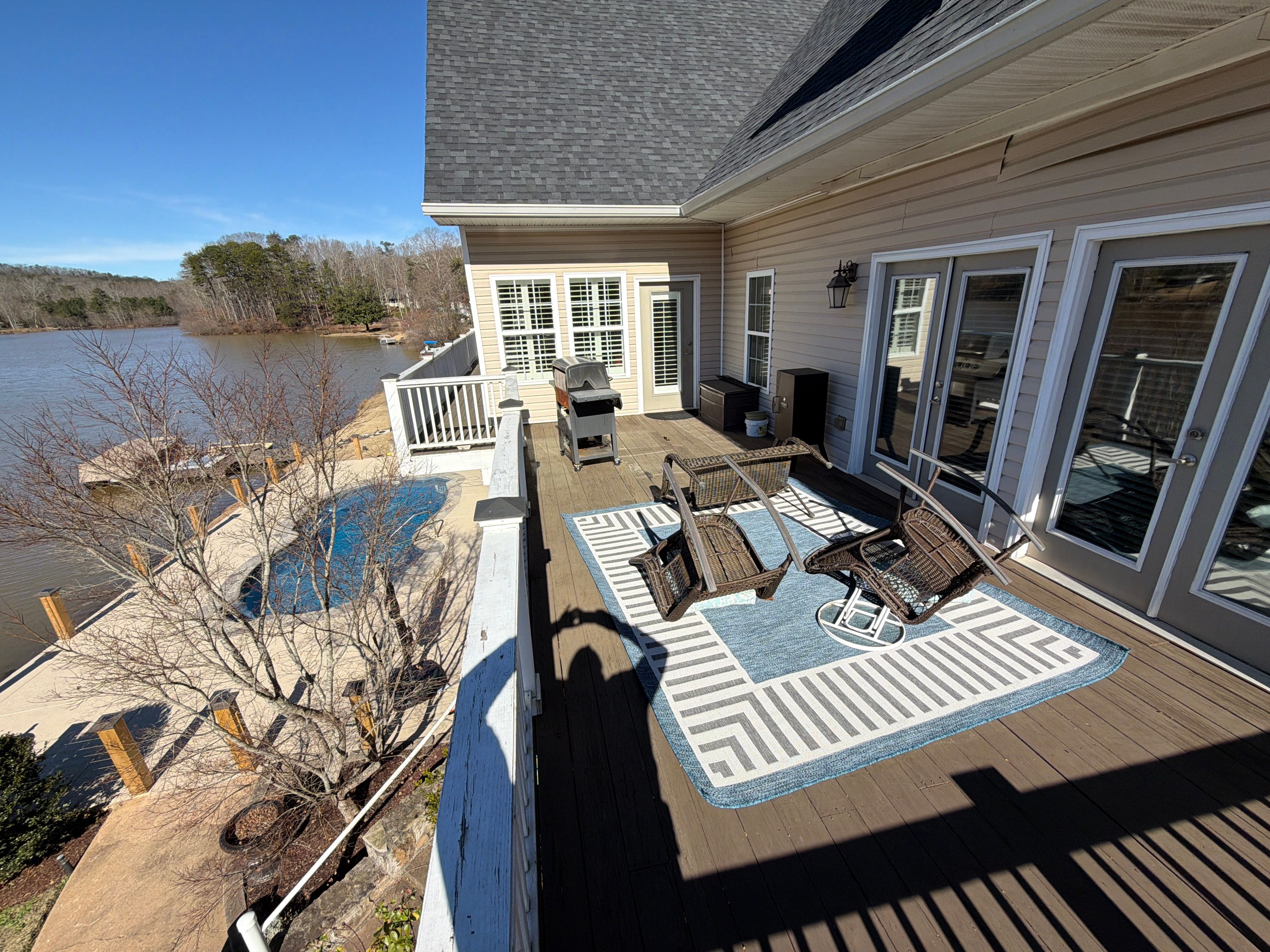 Cumming, GA Lake House Deck Resurface and Extension using Pressure Treated Pine and Skyline Cable Railing by Nelson Exteriors 