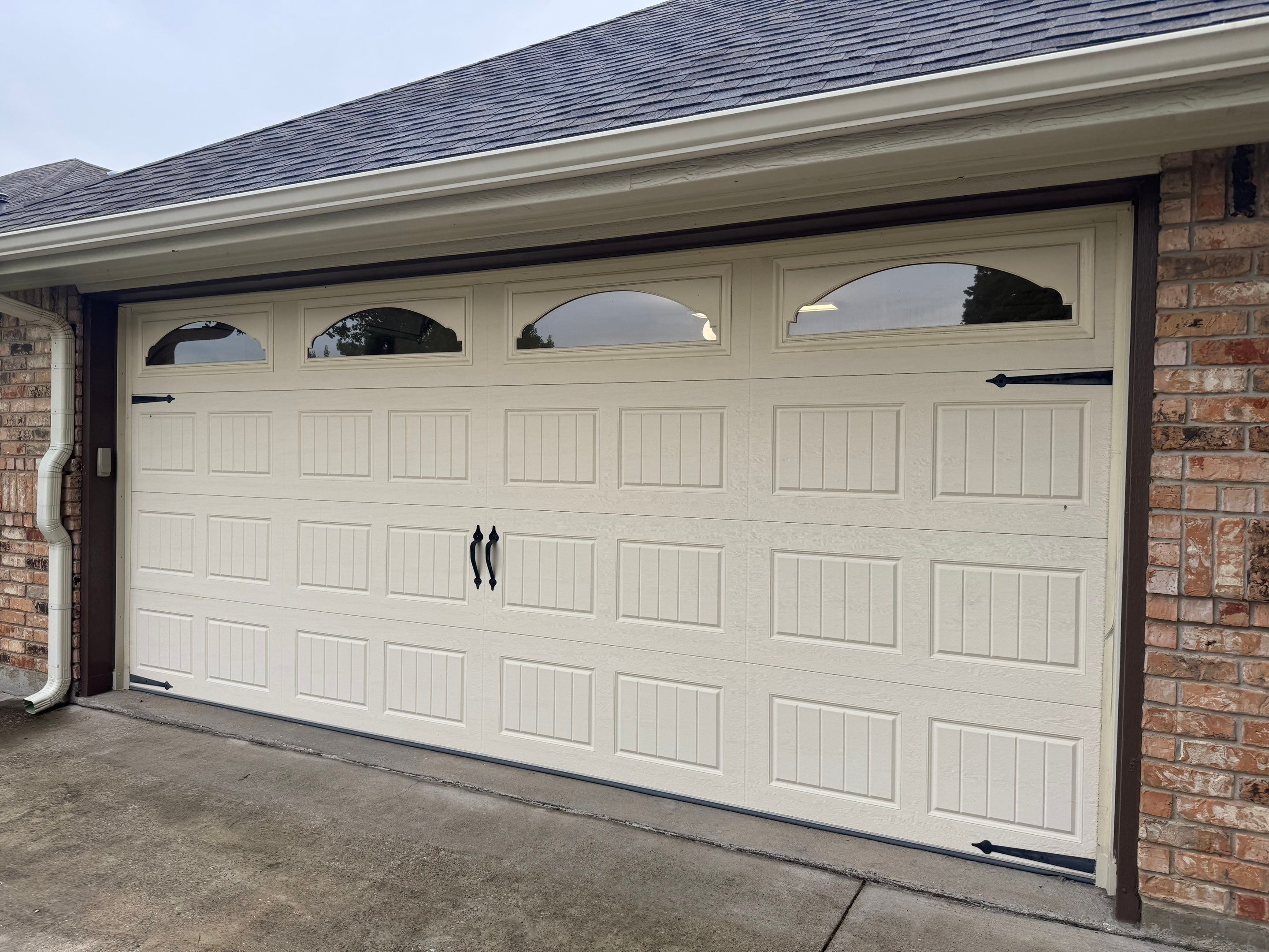 Custom Stained Cedar Garage Door Installation in Grapevine by Meadows Garage Doors
