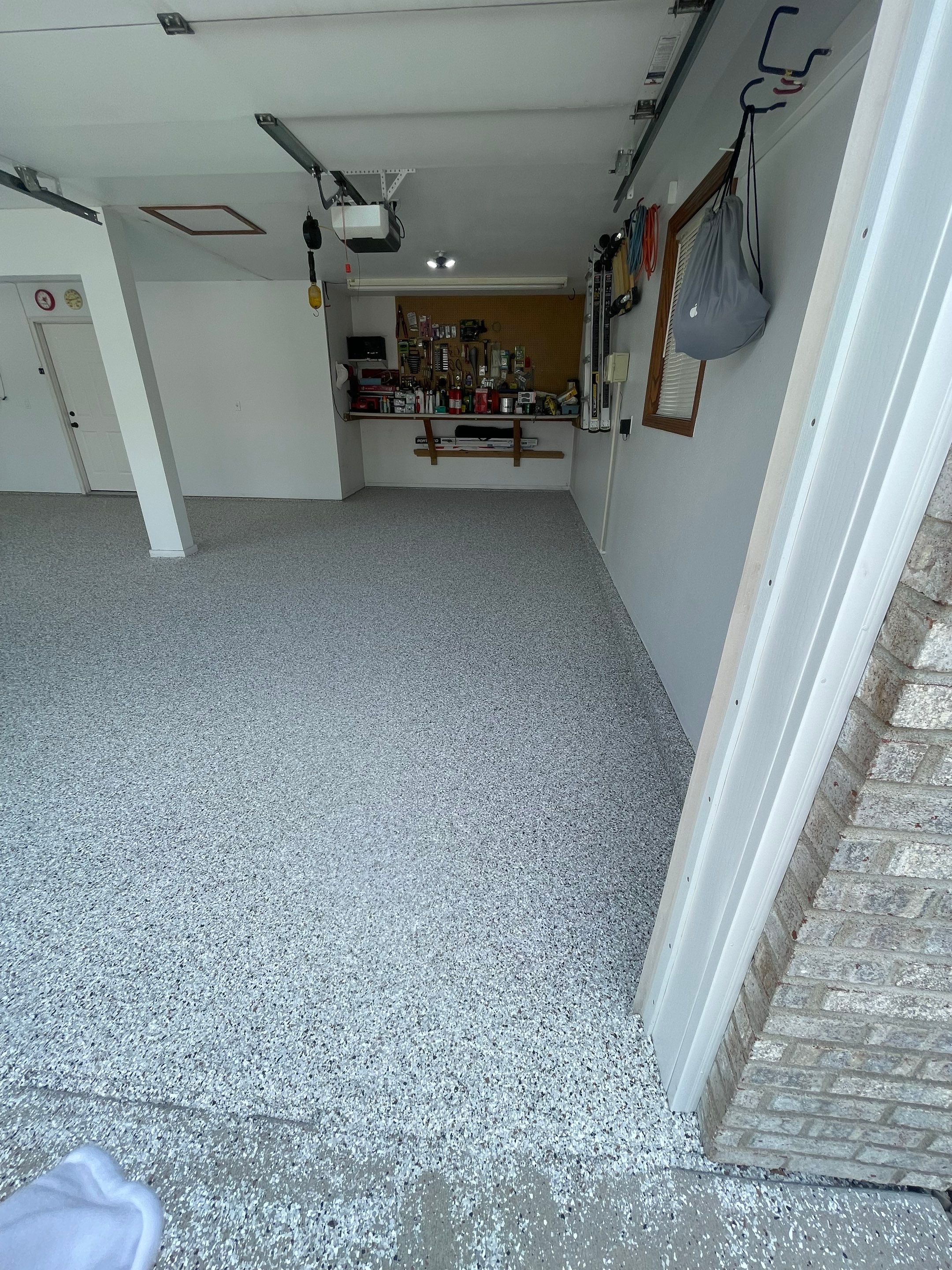 Multi-Car Garage Concrete Coating with Coyote Flake Finish in Sioux Falls by Select Painting, Coatings & Garage Cabinets