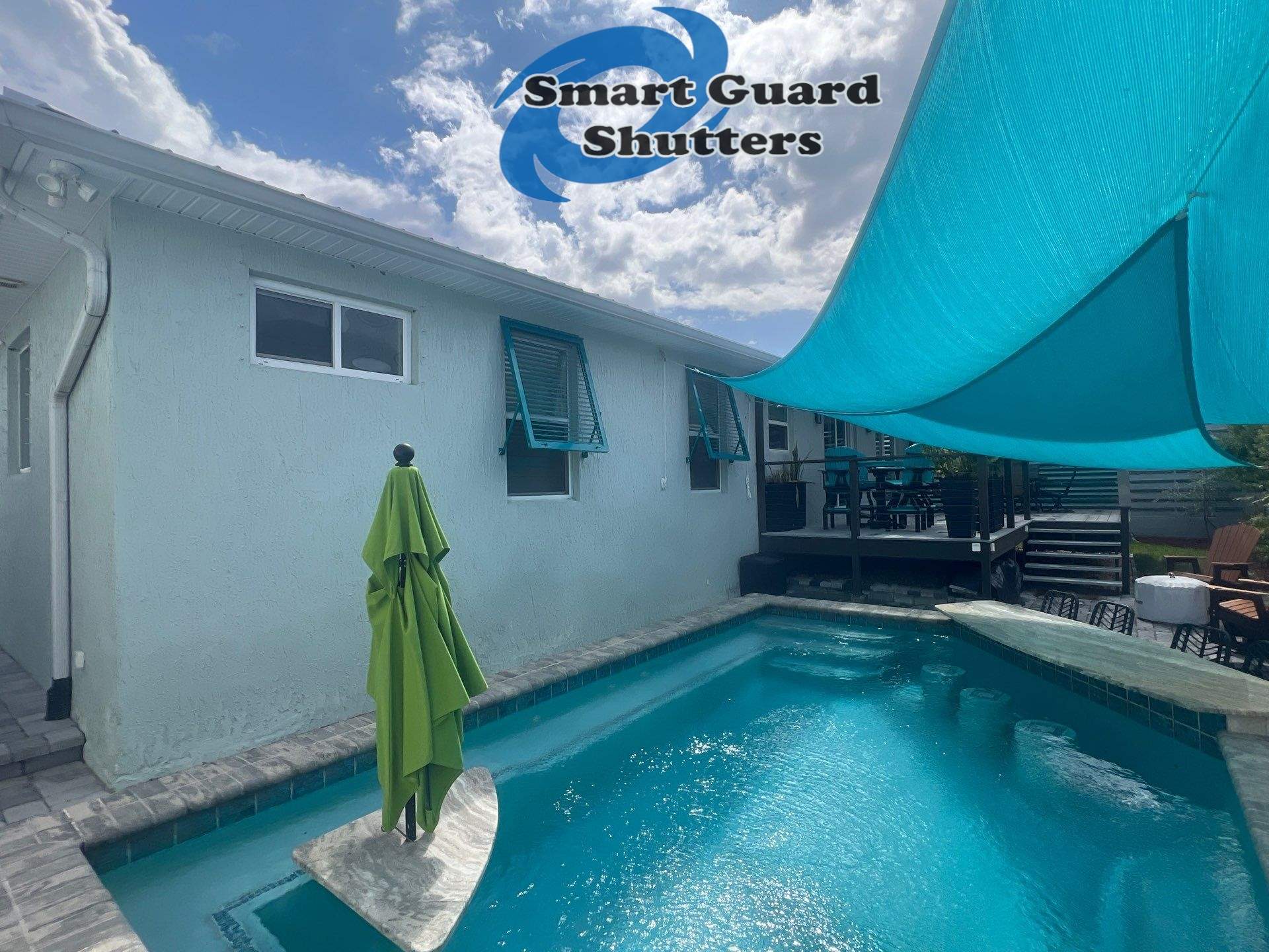 Impact Bahama Shutters in Water Blue by Smart Guard Shutters