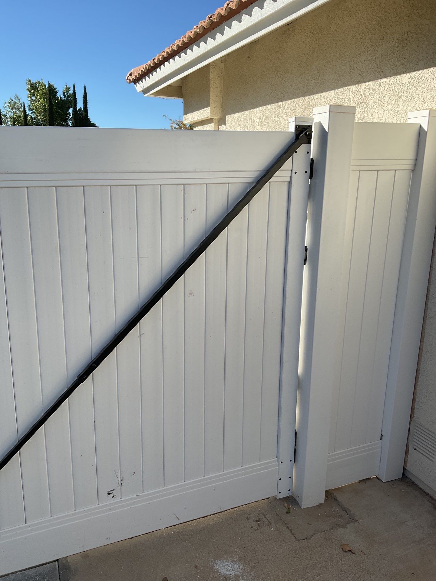 Gate installation using Vinyl by Fence Guys Inc. 