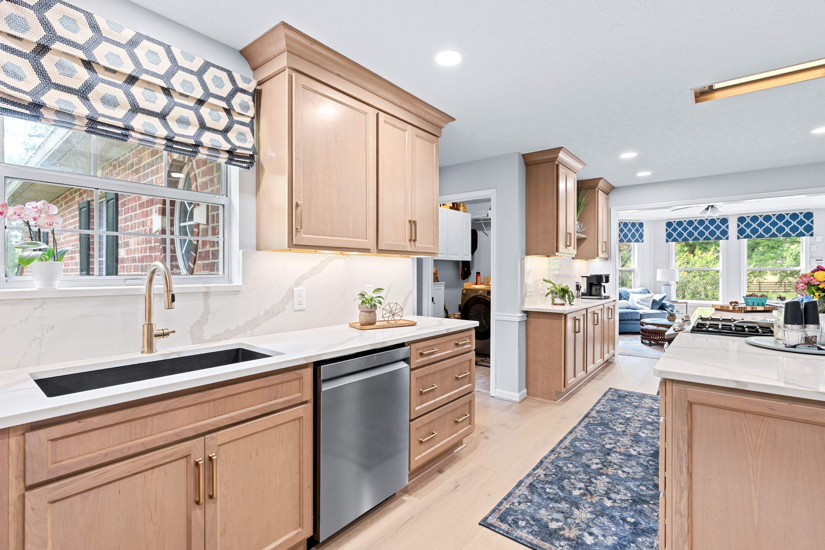 Modern Kitchen Remodel Featuring Quartz Backsplash, under cabinet lighintg, and a coffee bar in Mt. Juliet Tennessee by DeRo Renovations,LLC