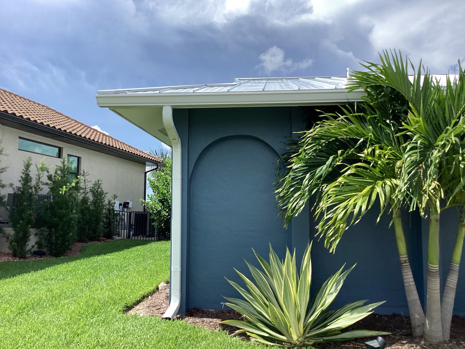 White Downspouts and Gutters Combo in Punta Gorda FL by Gutter Professors