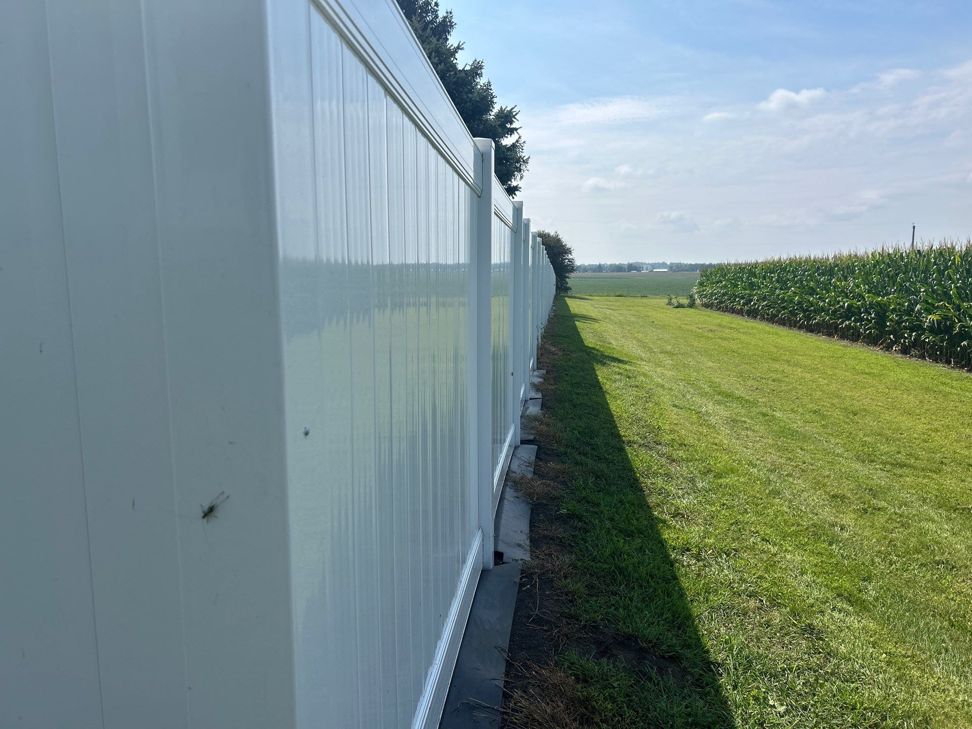 White Vinyl Privacy Fence Installation in Waterloo Iowa by Perfect Picket Fence and Stain