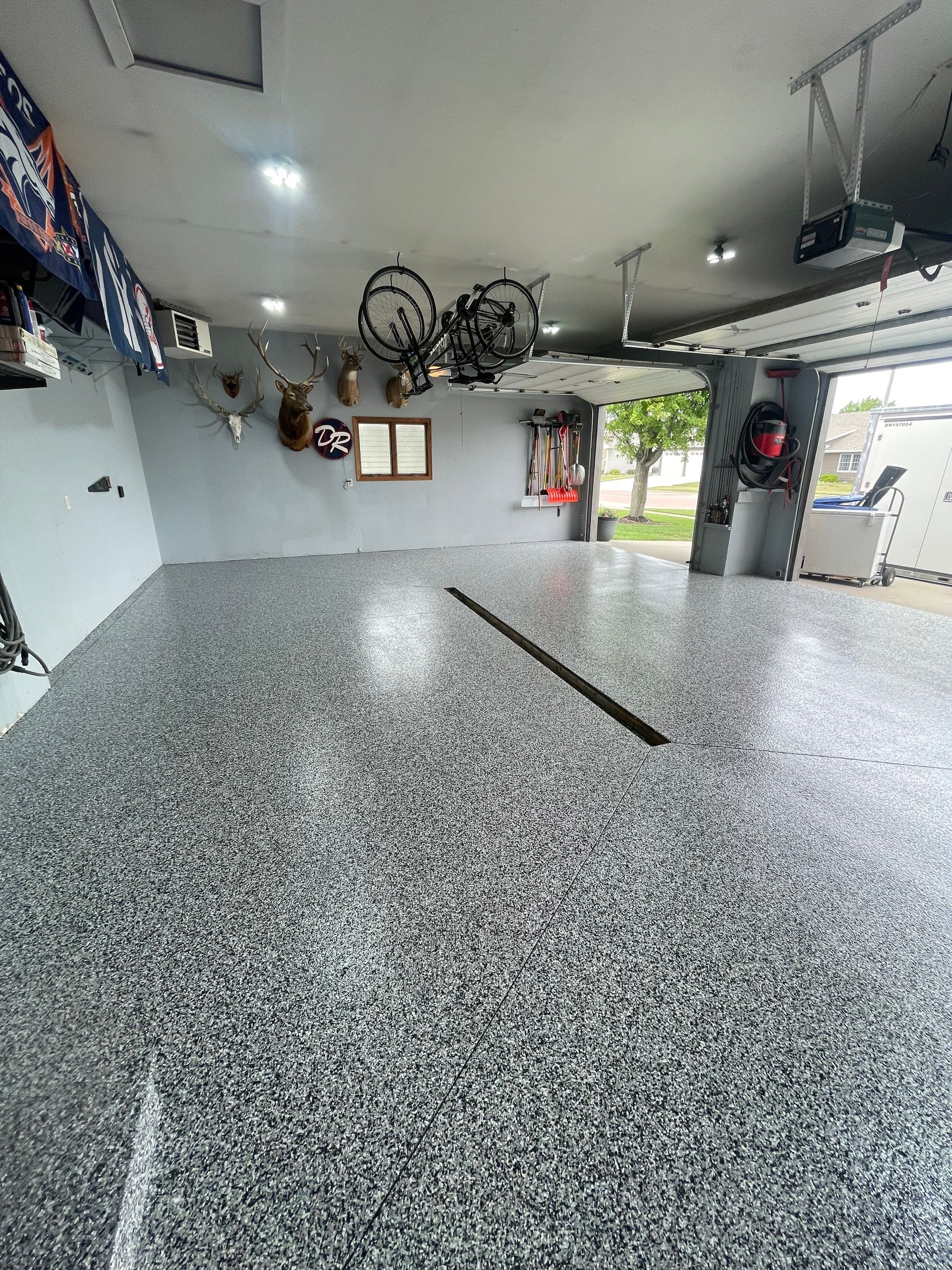Full Garage Floor Epoxy Coating Installation in Dell Rapids by Select Painting, Coatings & Garage Cabinets