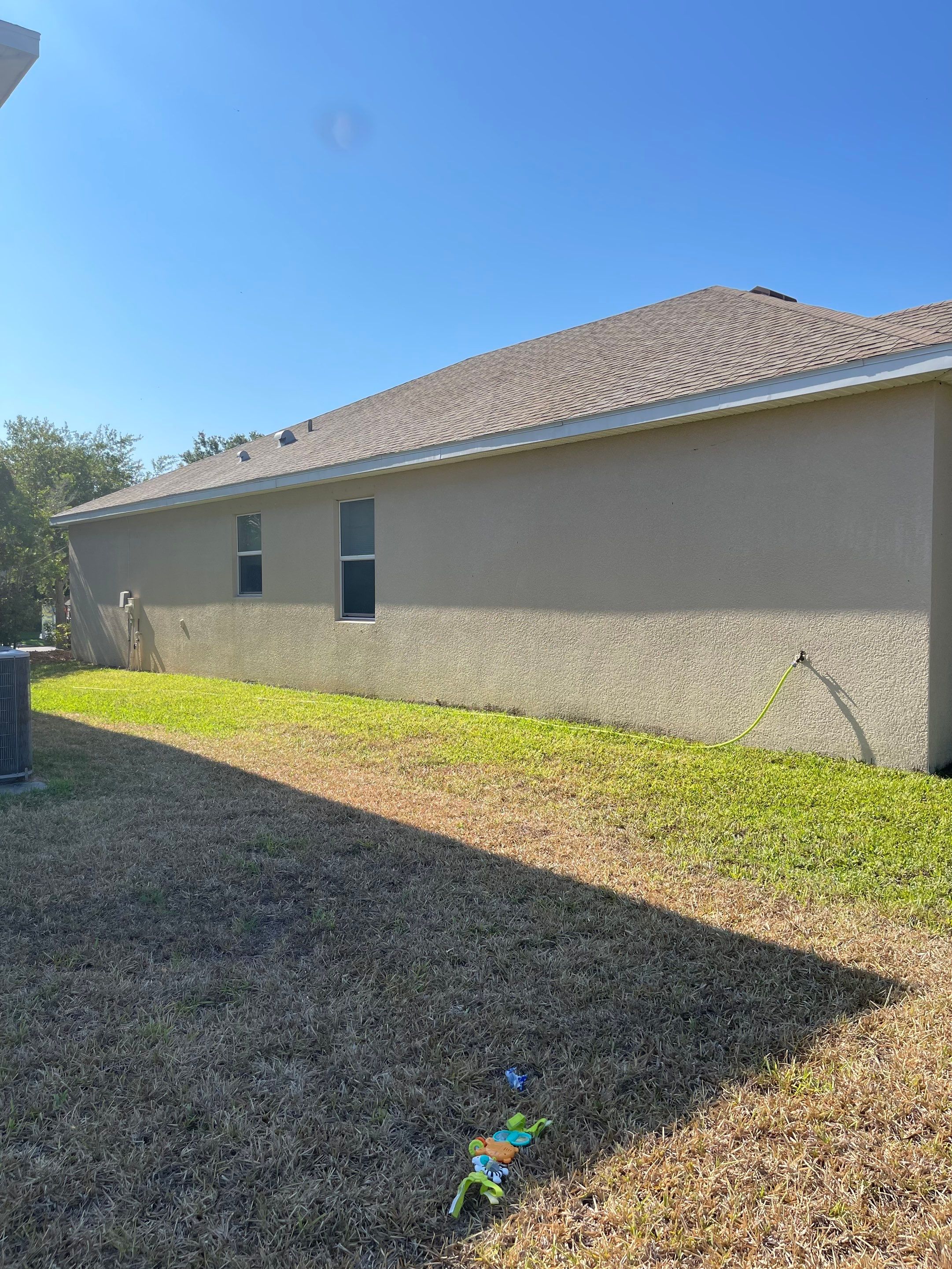 Asphalt Shingle Roof Soft Wash Cleaning & Concrete Pressure Washing in CopperStone Community, Parrish, FL by Sunshine AquaWash